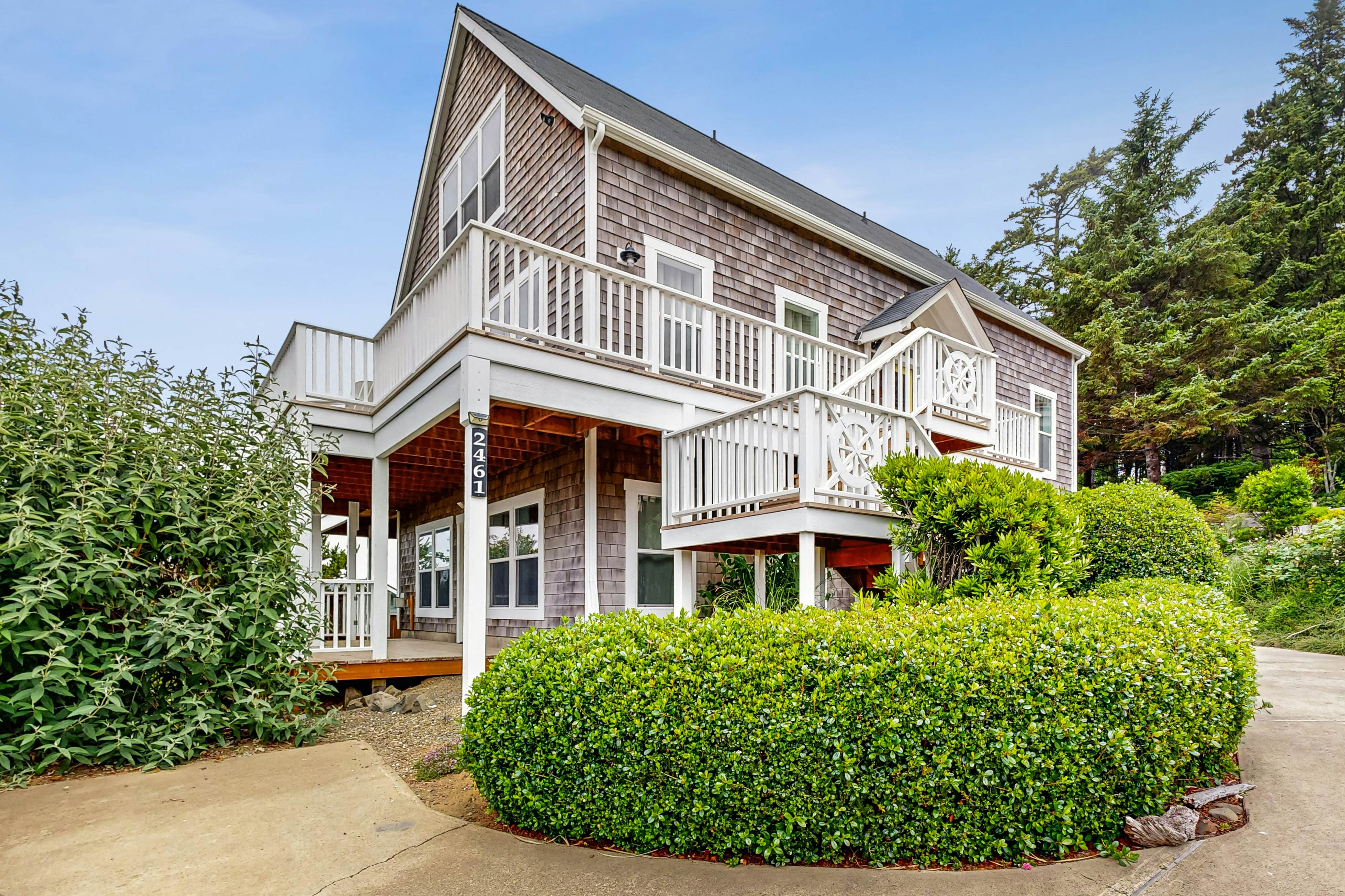Ocean-view home with hot tub, game room, furnished deck, & fireplaces