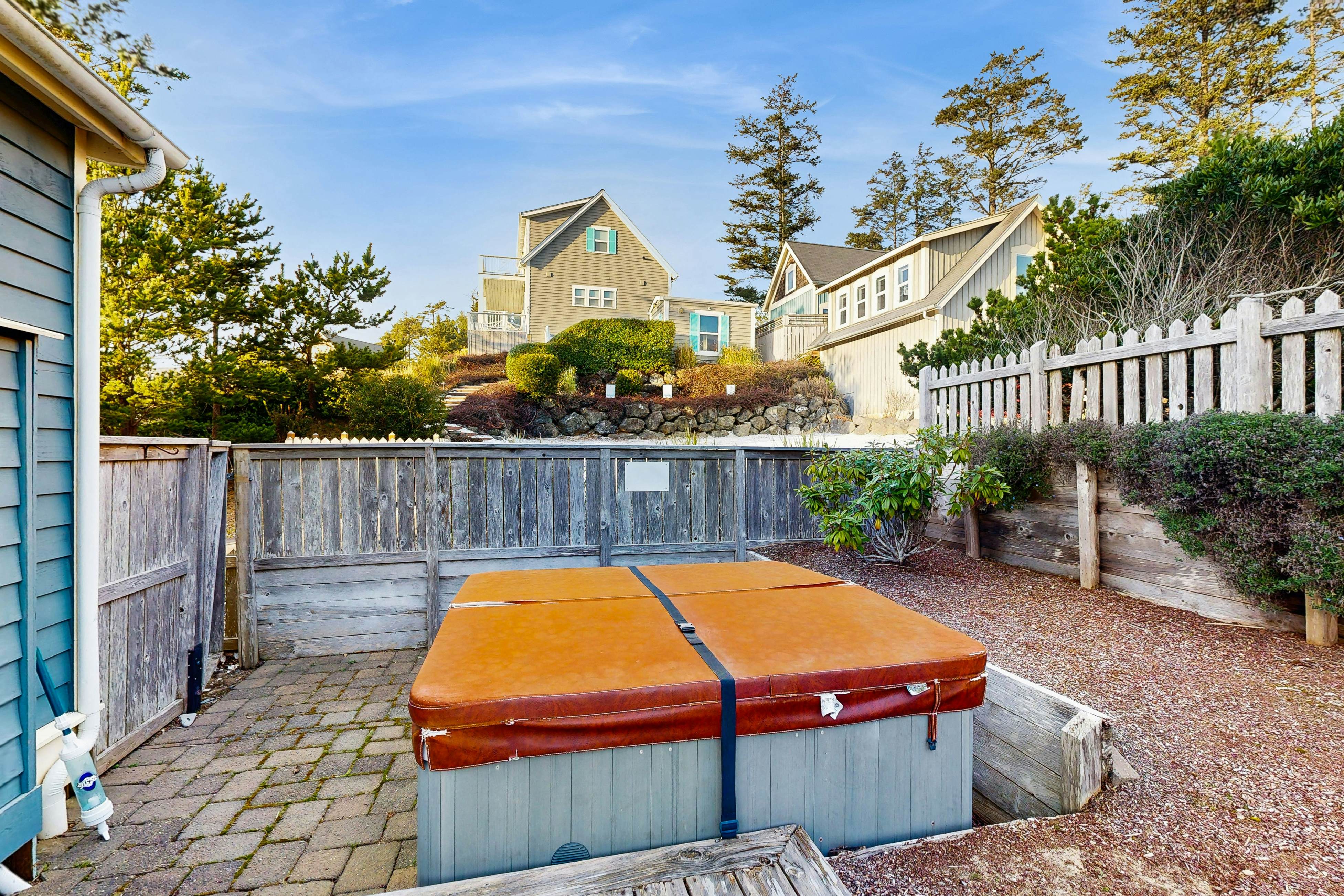 Charming, two-story home with a private hot tub, large patio, & washer/dryer