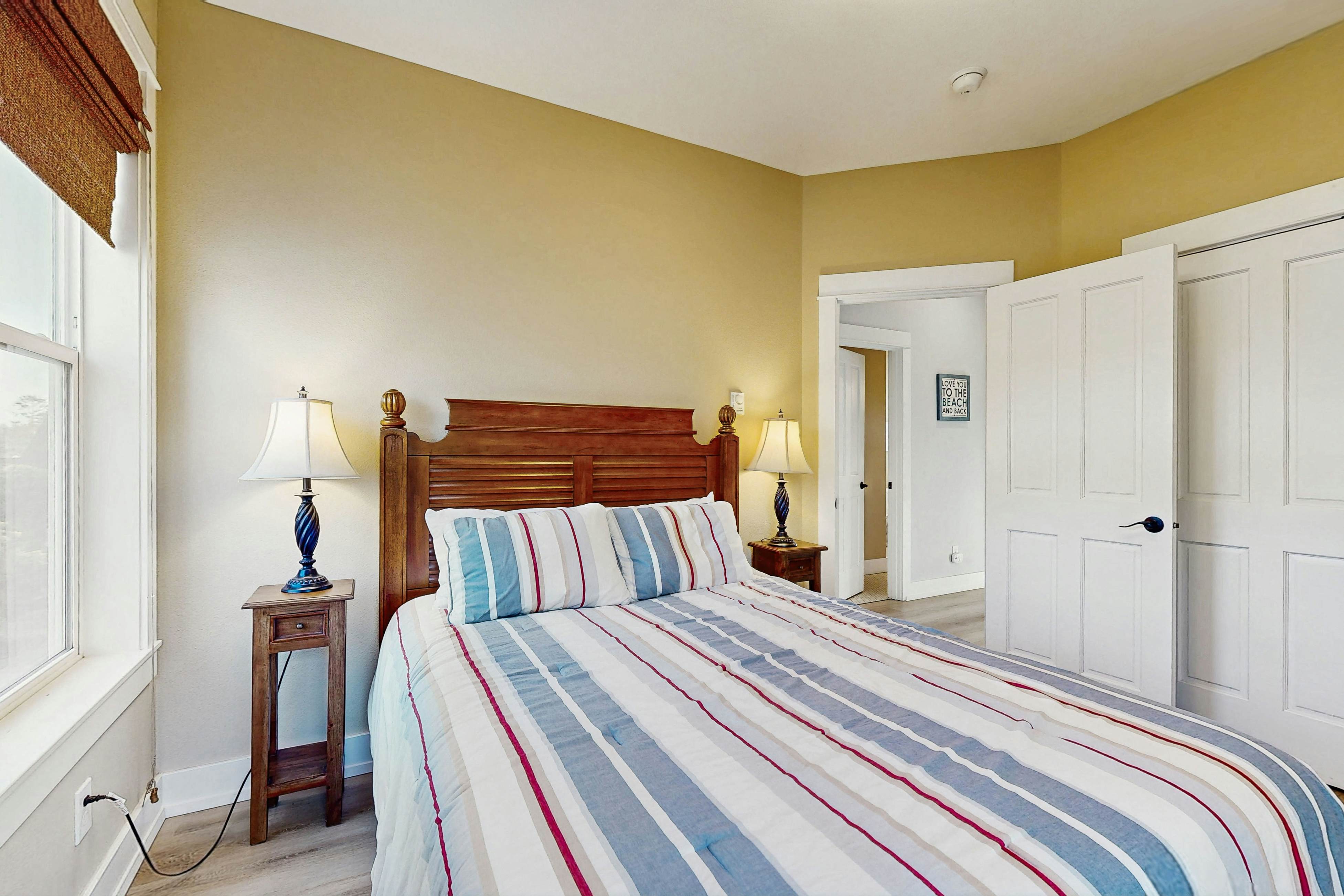 Charming, two-story home with a private hot tub, large patio, & washer/dryer