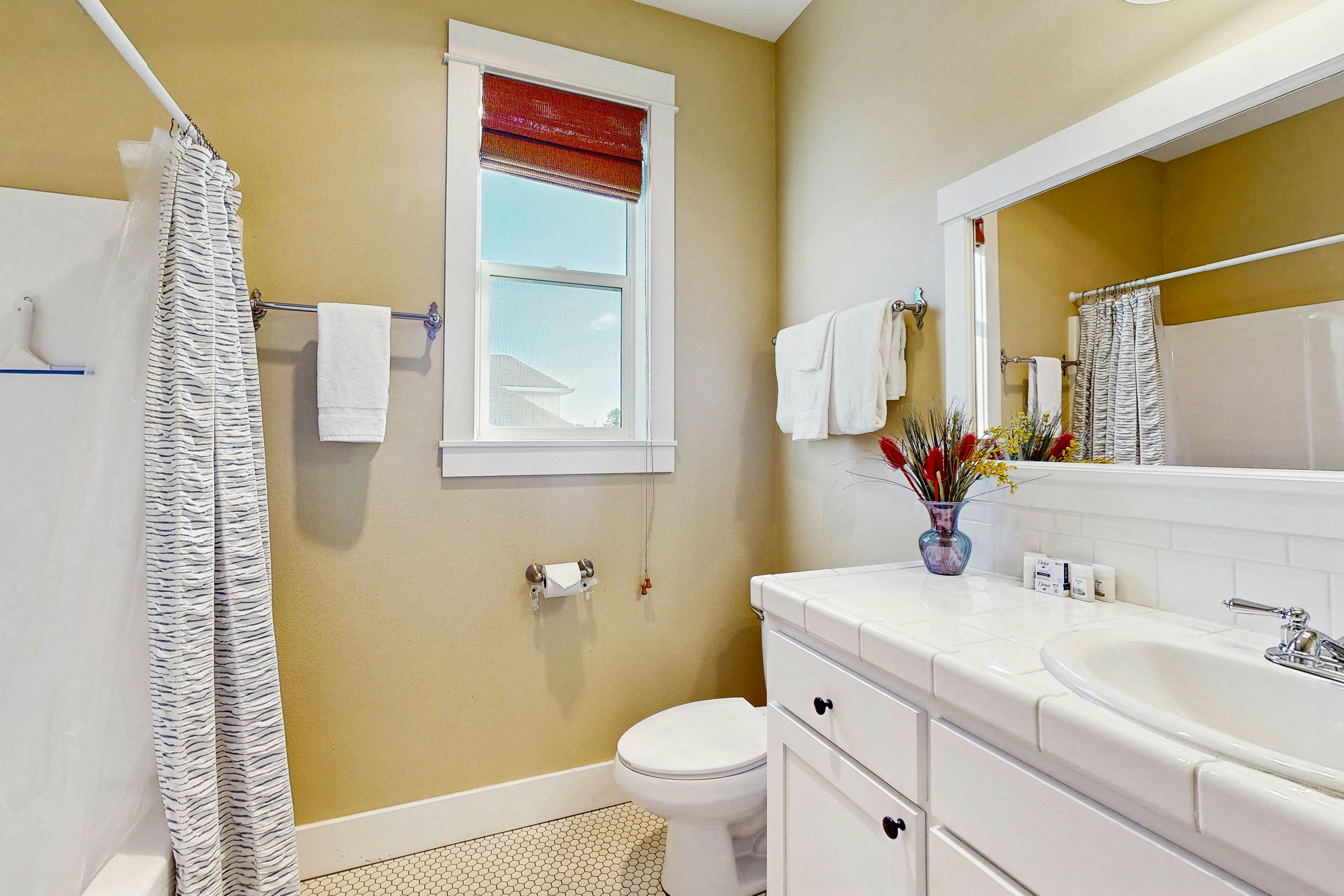 Charming, two-story home with a private hot tub, large patio, & washer/dryer