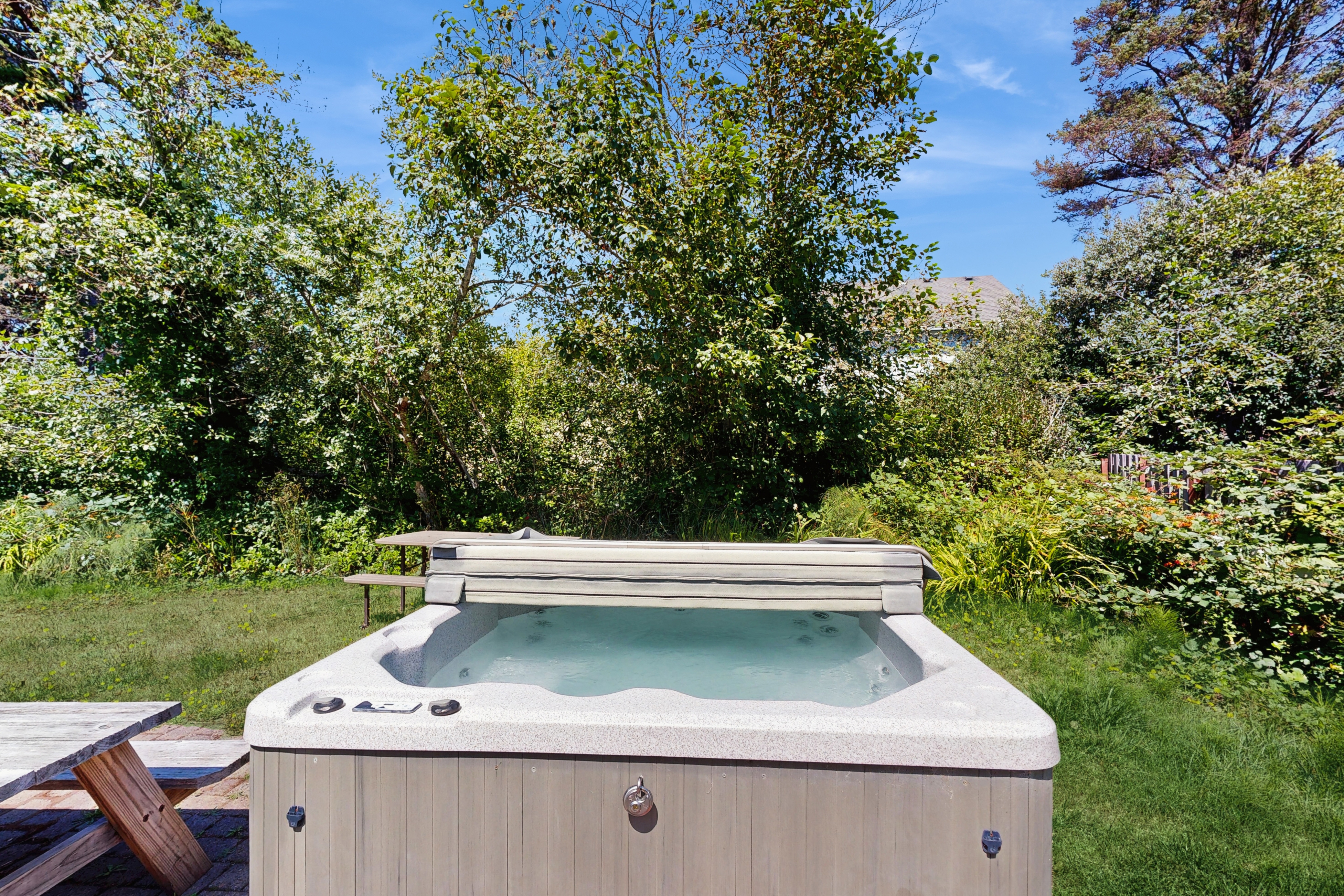 Expansive family friendly home with a private hot tub walk to the beach