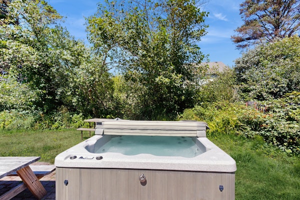 Expansive family friendly home with a private hot tub walk to the beach