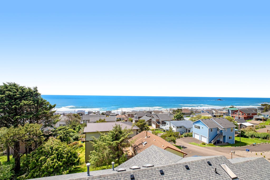 Limited Time Deals Coastal Hideaway with Ocean Views and Spacious Deck
