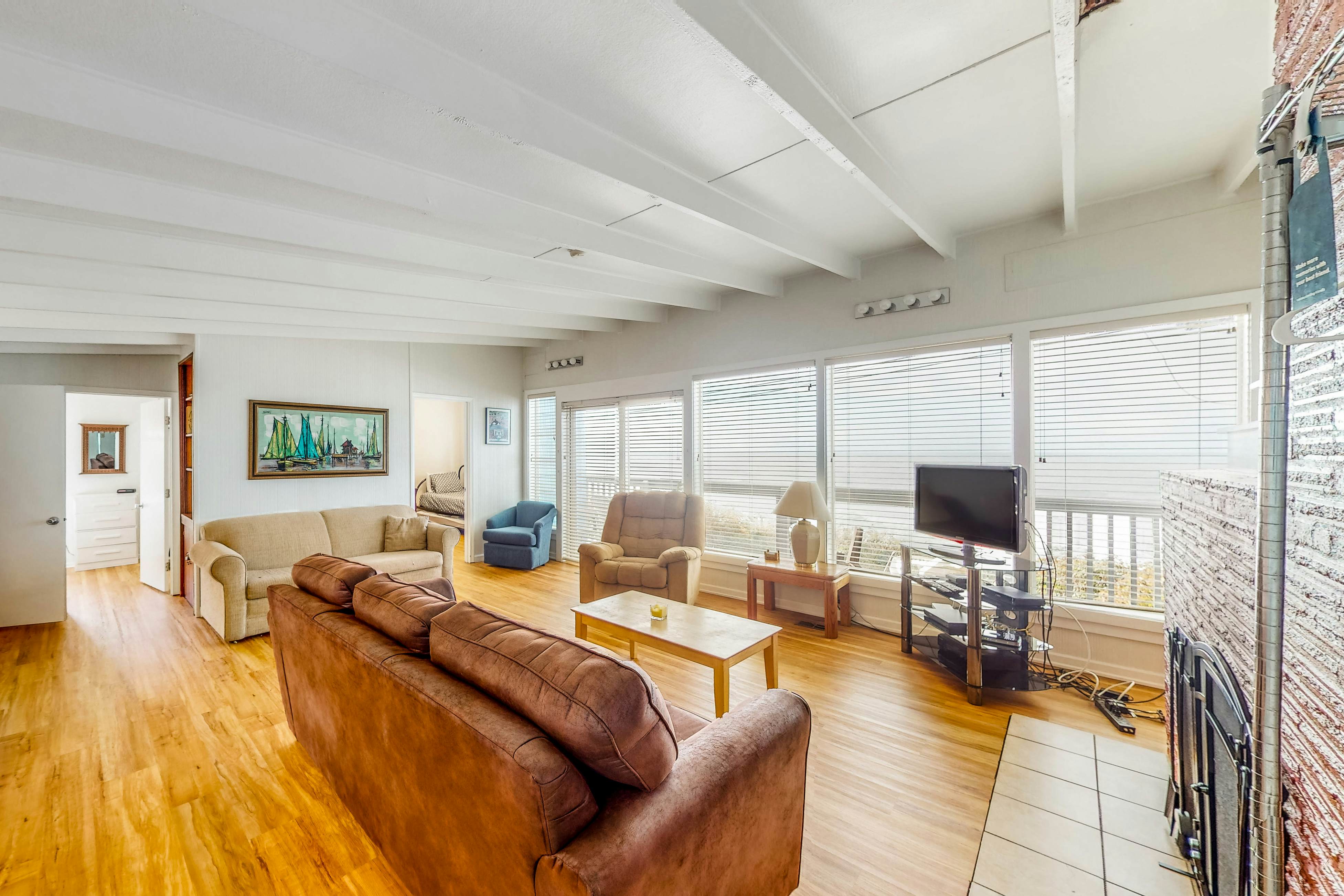 Dog-friendly home with deck & ocean views - close to the beach