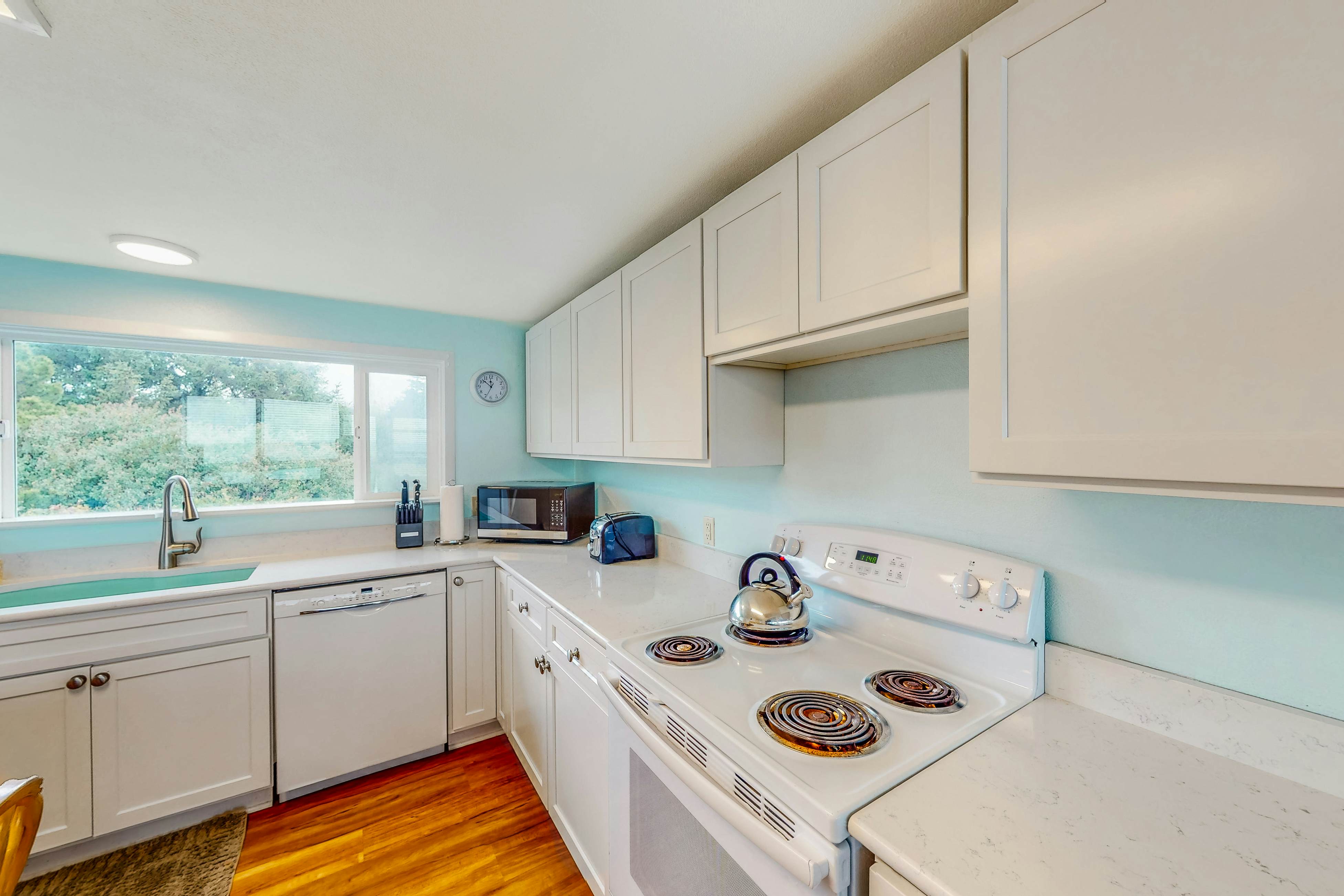 Dog-friendly home with deck & ocean views - close to the beach