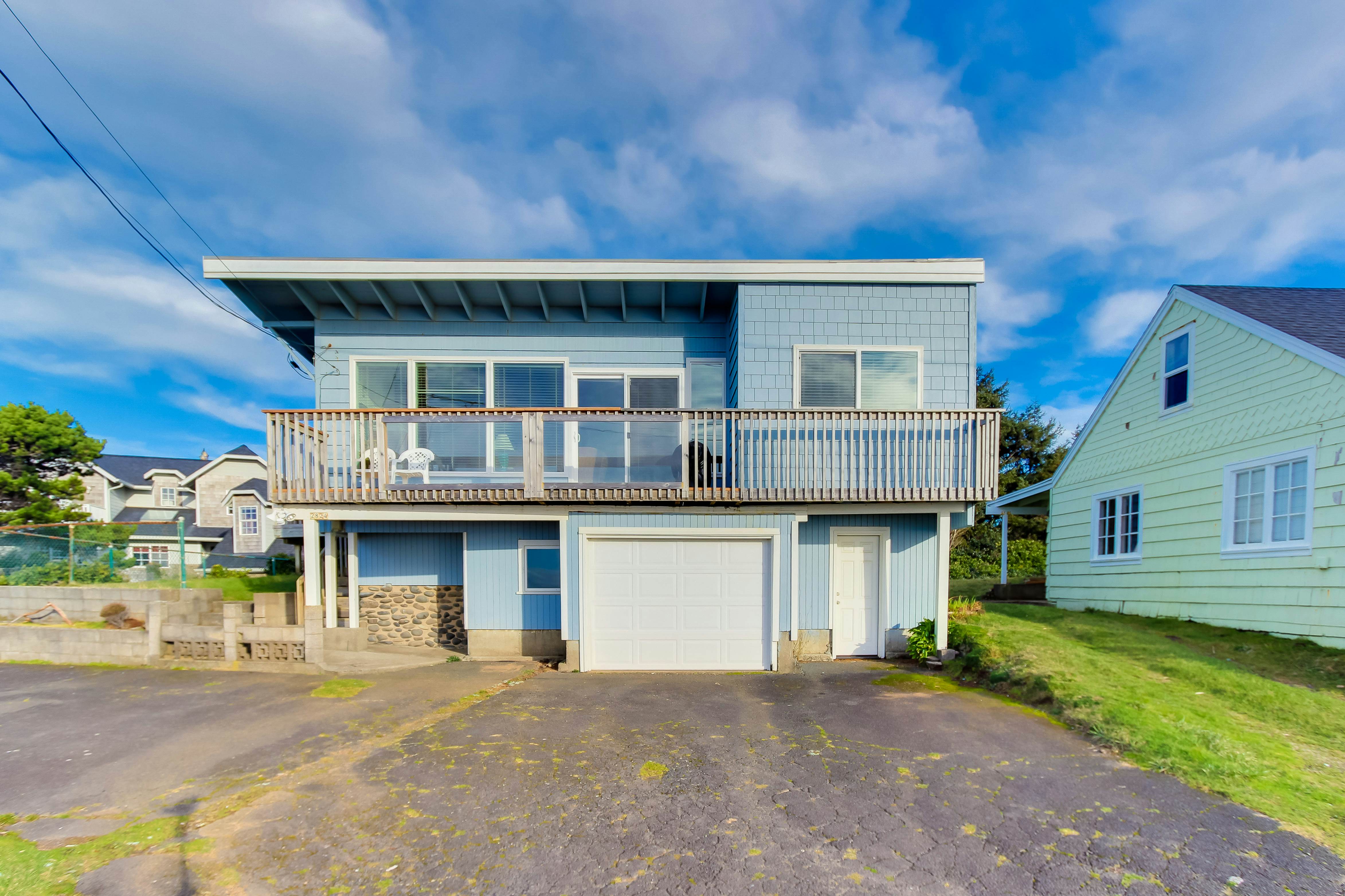 Dog-friendly home with deck & ocean views - close to the beach