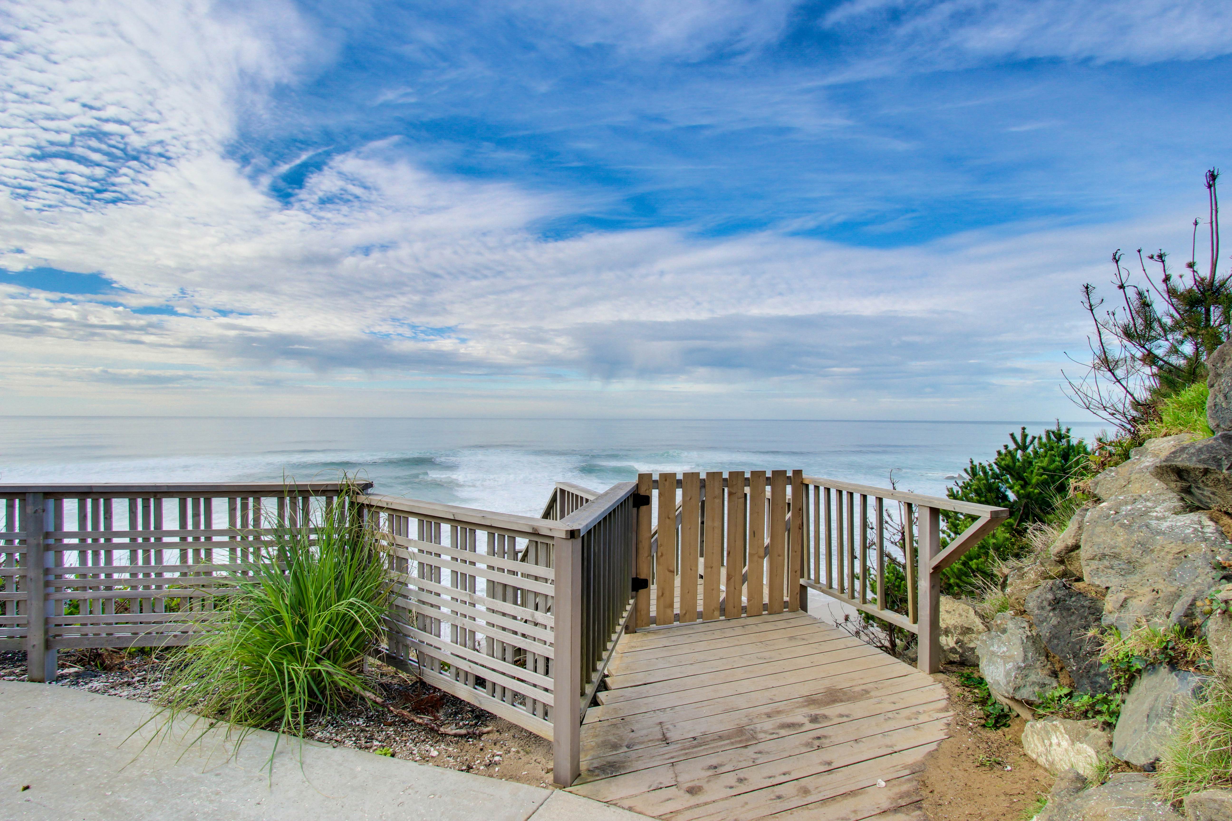 Dog-friendly home with deck & ocean views - close to the beach