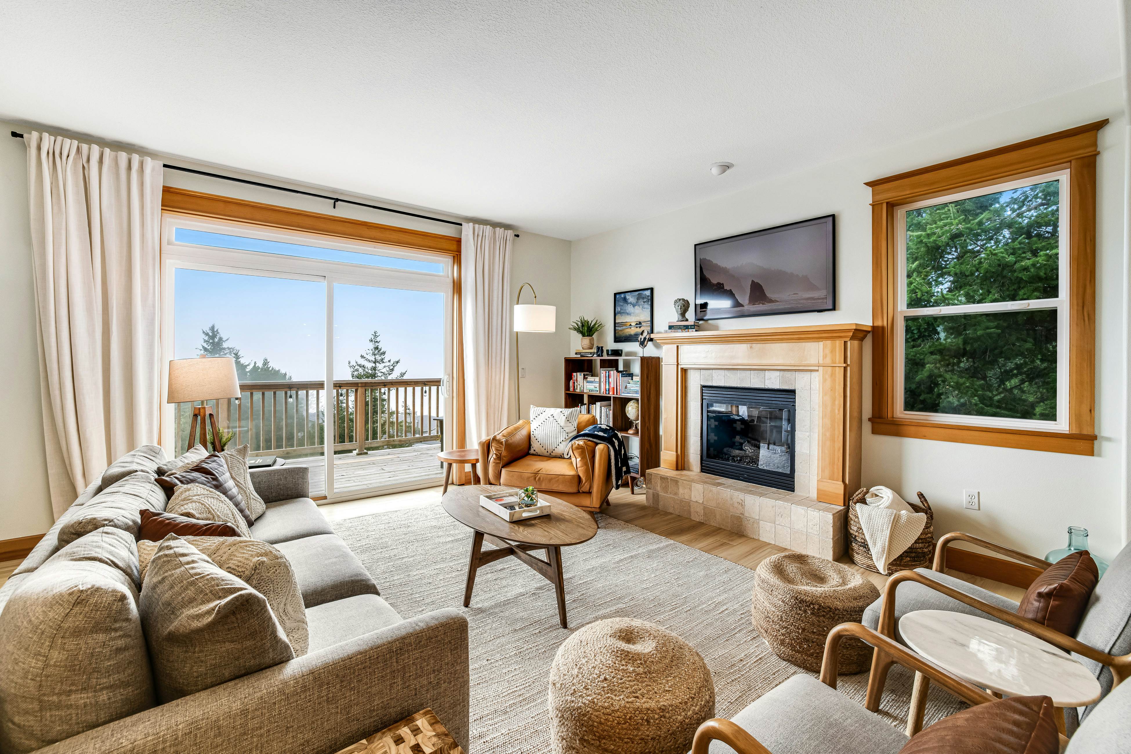 Dog-friendly home with ocean views, deck, washer/dryer, grill, & fireplace