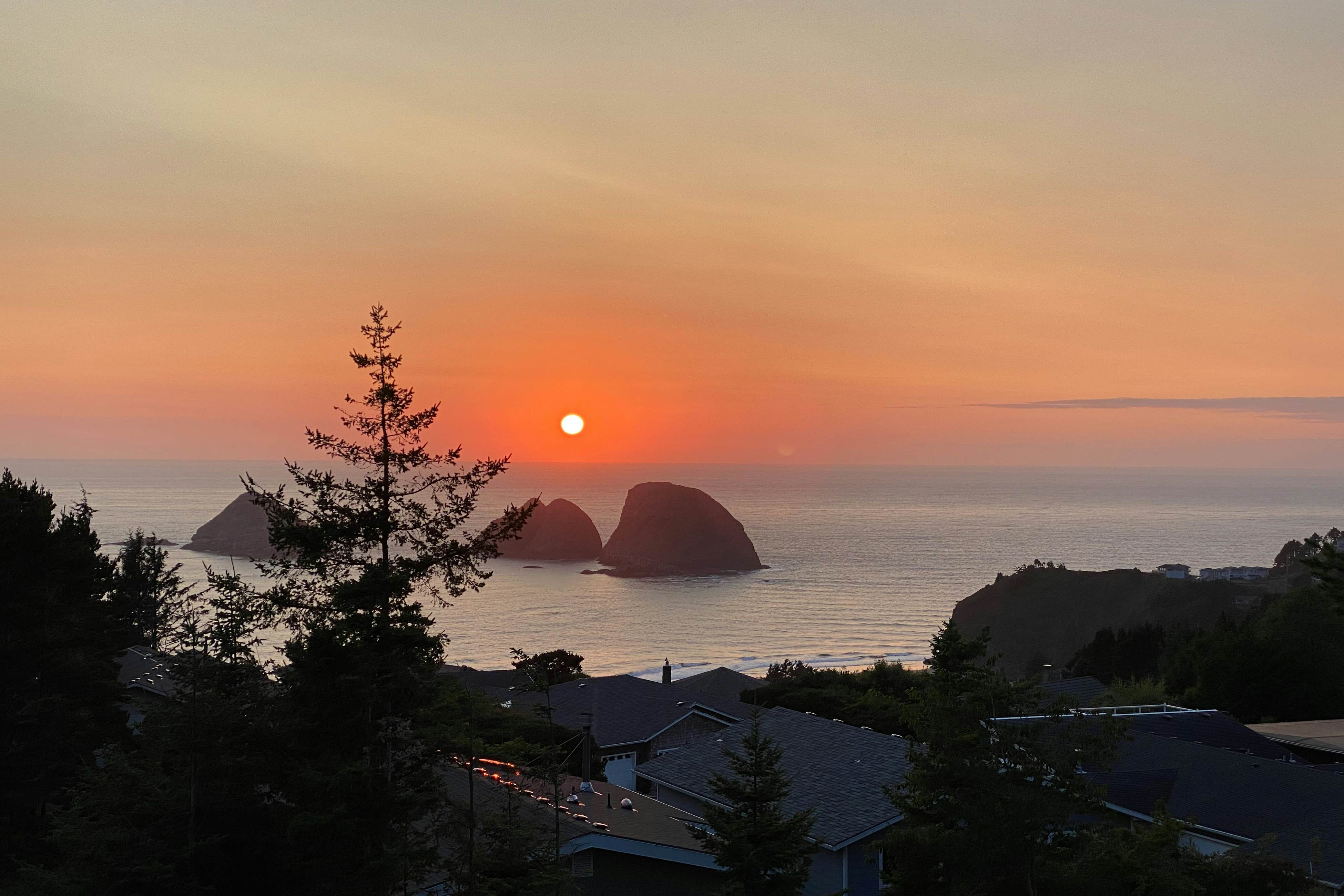 Dog-friendly home with ocean views, deck, washer/dryer, grill, & fireplace