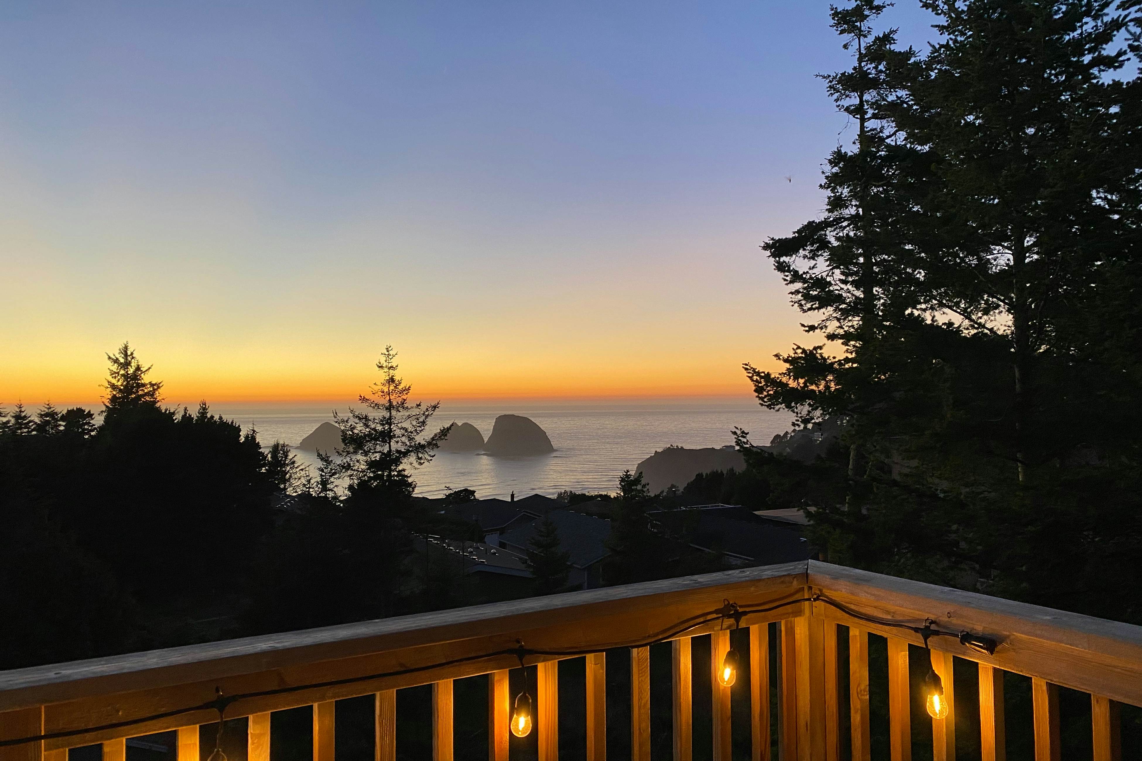 Dog-friendly home with ocean views, deck, washer/dryer, grill, & fireplace