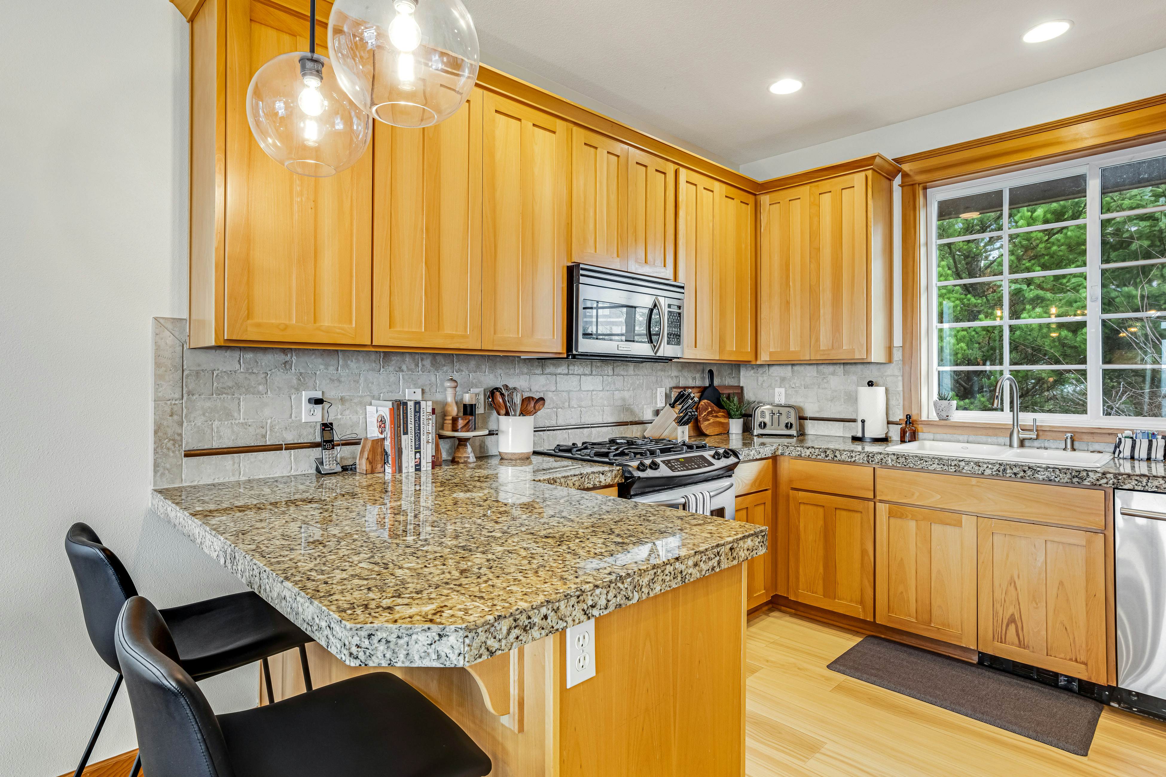 Dog-friendly home with ocean views, deck, washer/dryer, grill, & fireplace