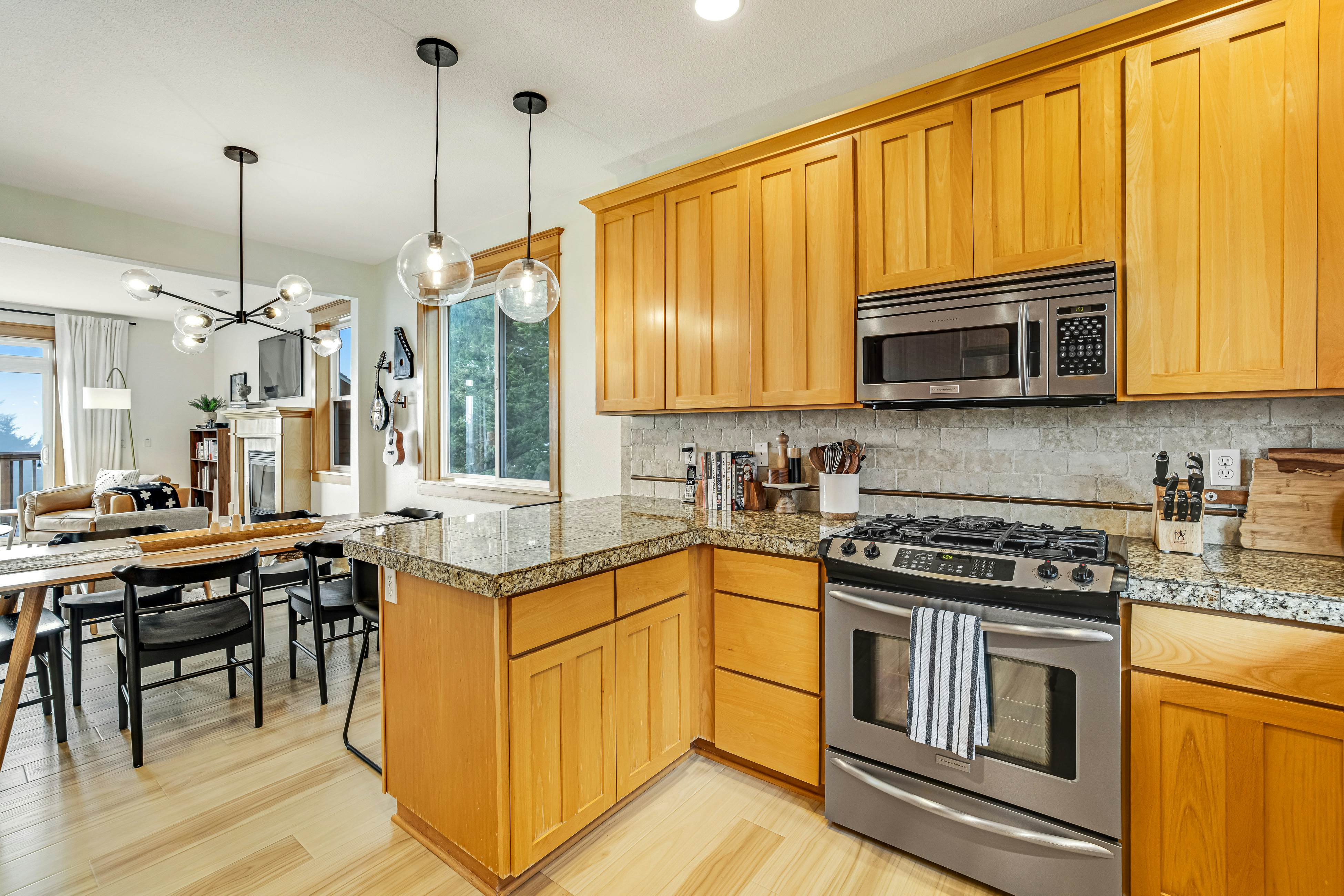 Dog-friendly home with ocean views, deck, washer/dryer, grill, & fireplace