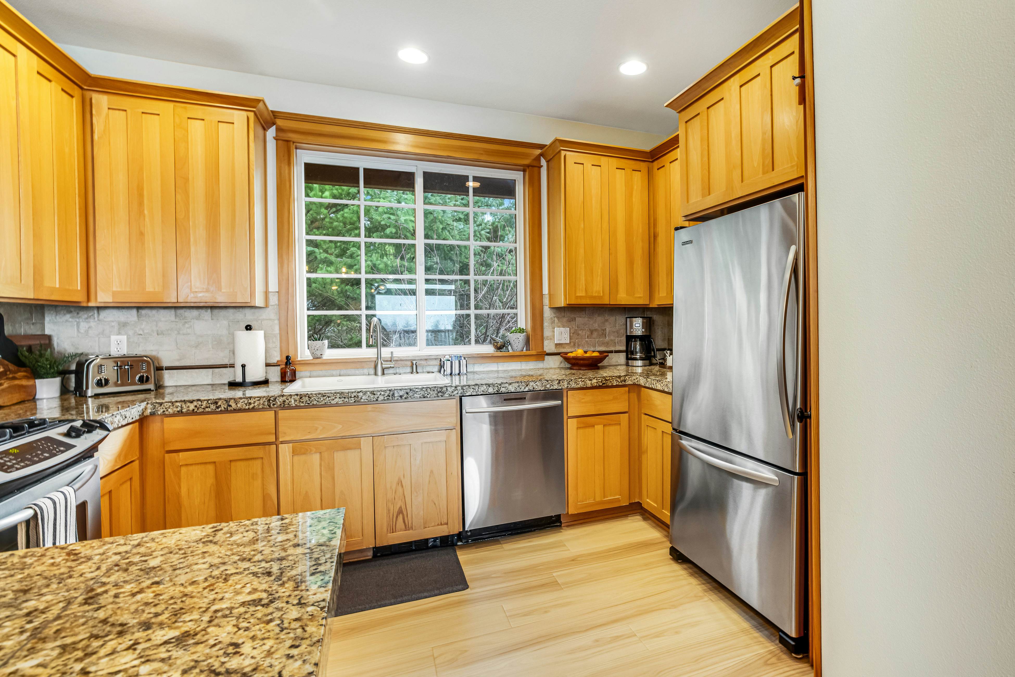 Dog-friendly home with ocean views, deck, washer/dryer, grill, & fireplace