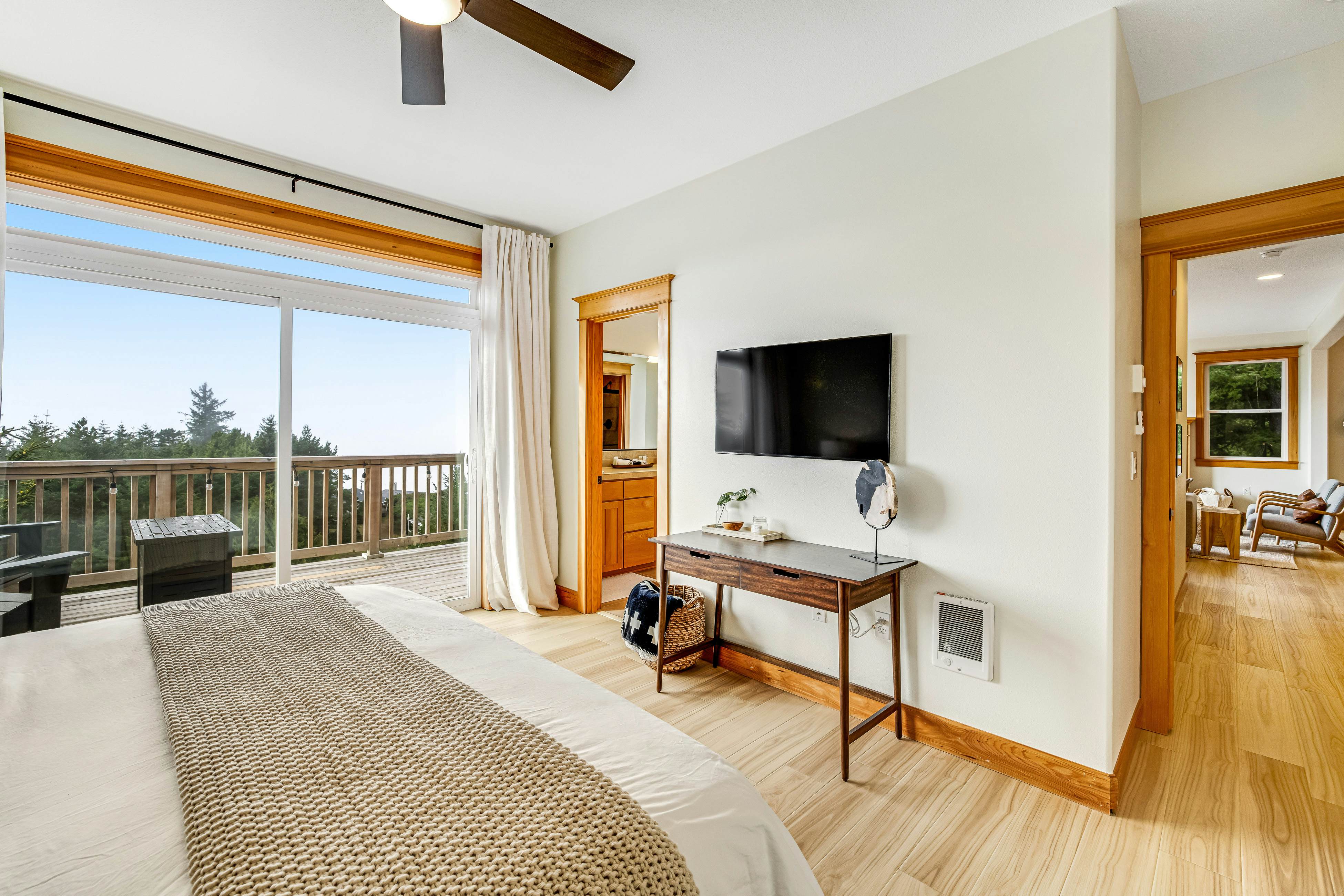 Dog-friendly home with ocean views, deck, washer/dryer, grill, & fireplace