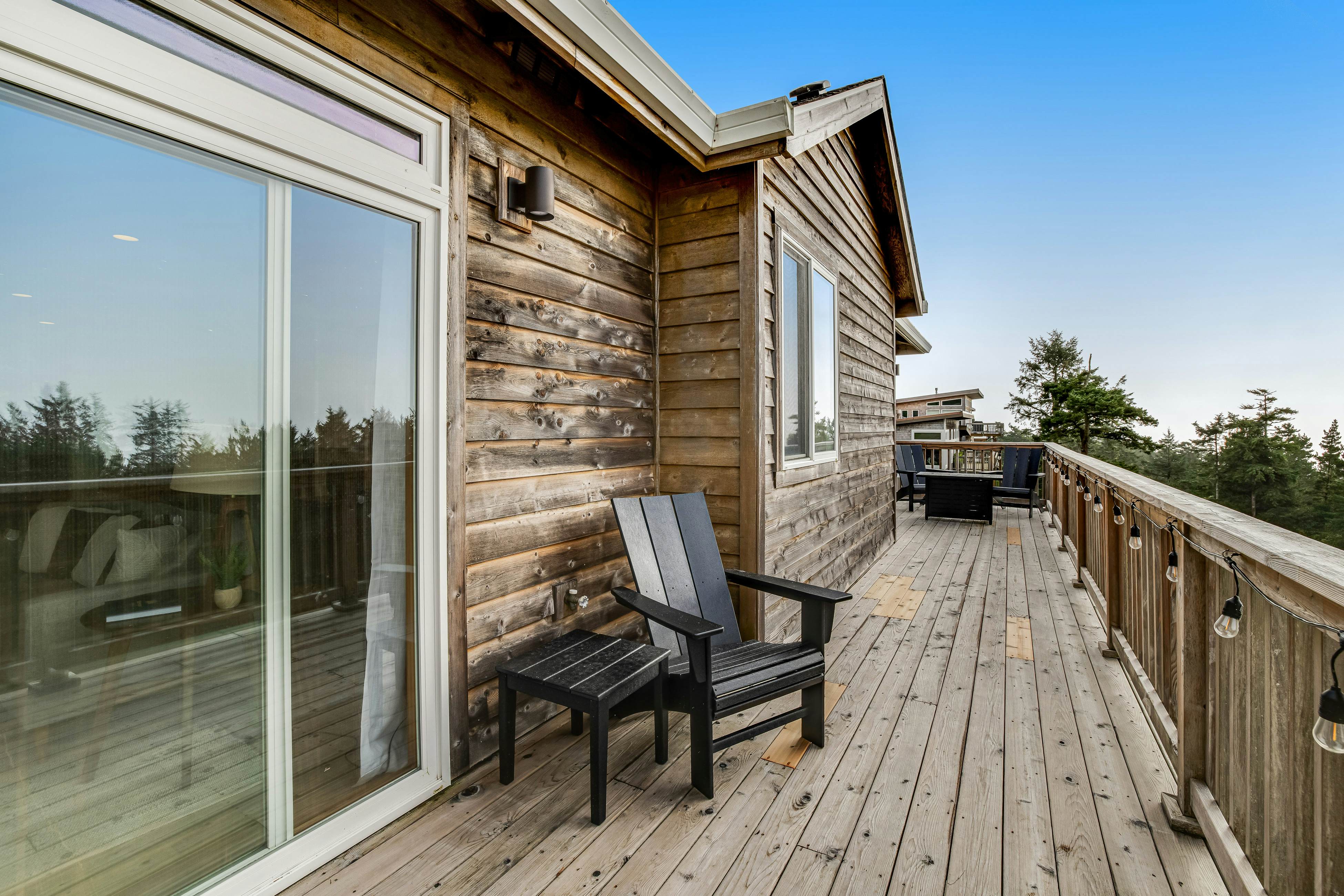 Dog-friendly home with ocean views, deck, washer/dryer, grill, & fireplace