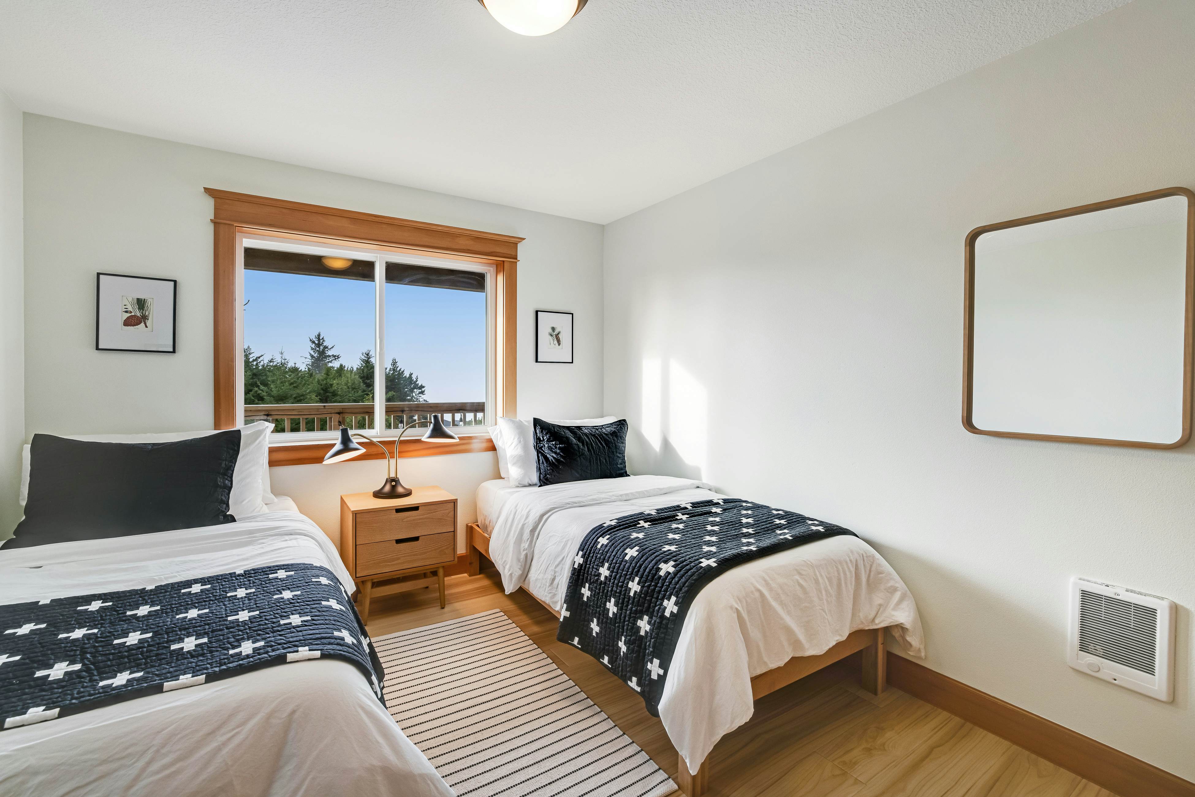 Dog-friendly home with ocean views, deck, washer/dryer, grill, & fireplace