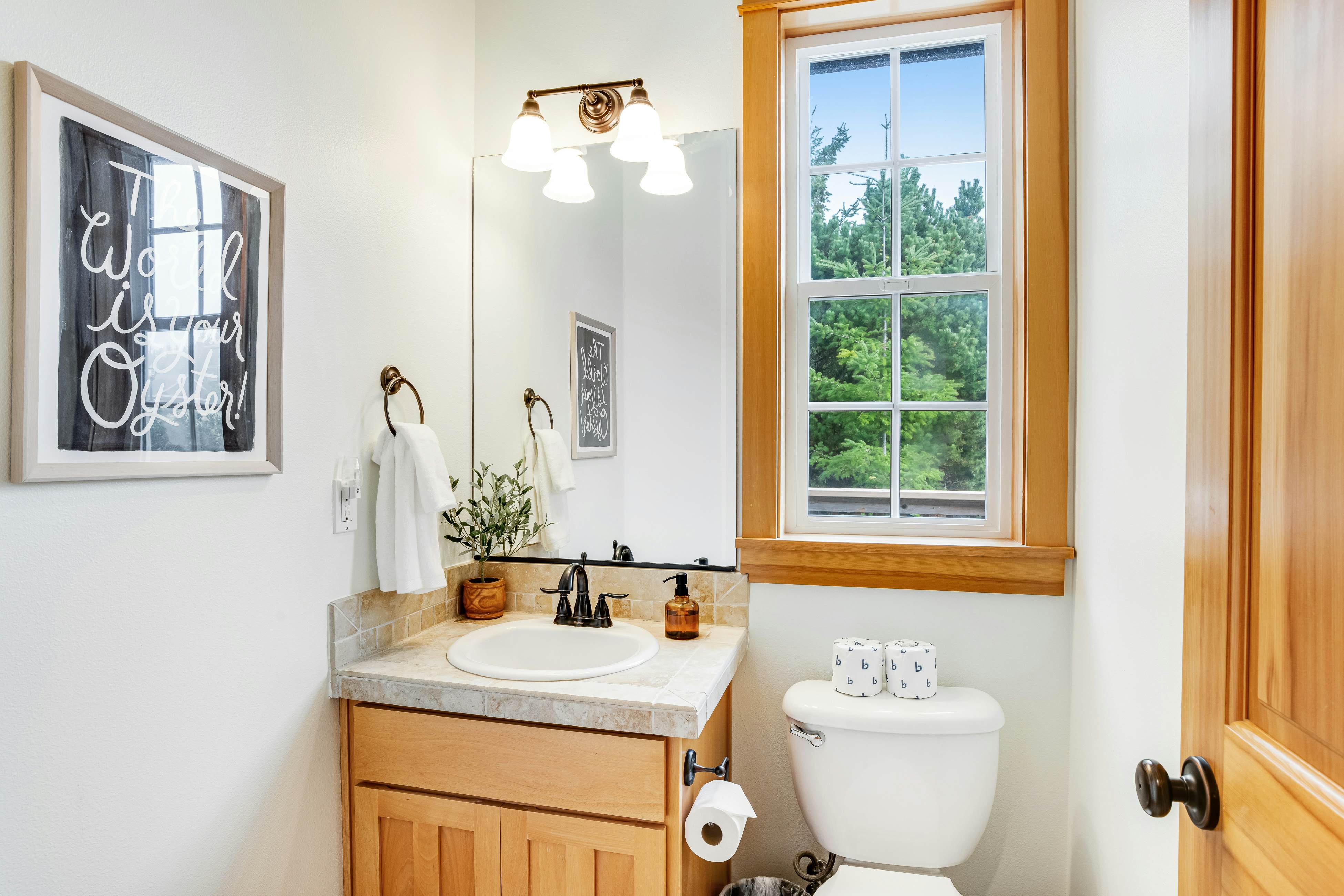 Dog-friendly home with ocean views, deck, washer/dryer, grill, & fireplace