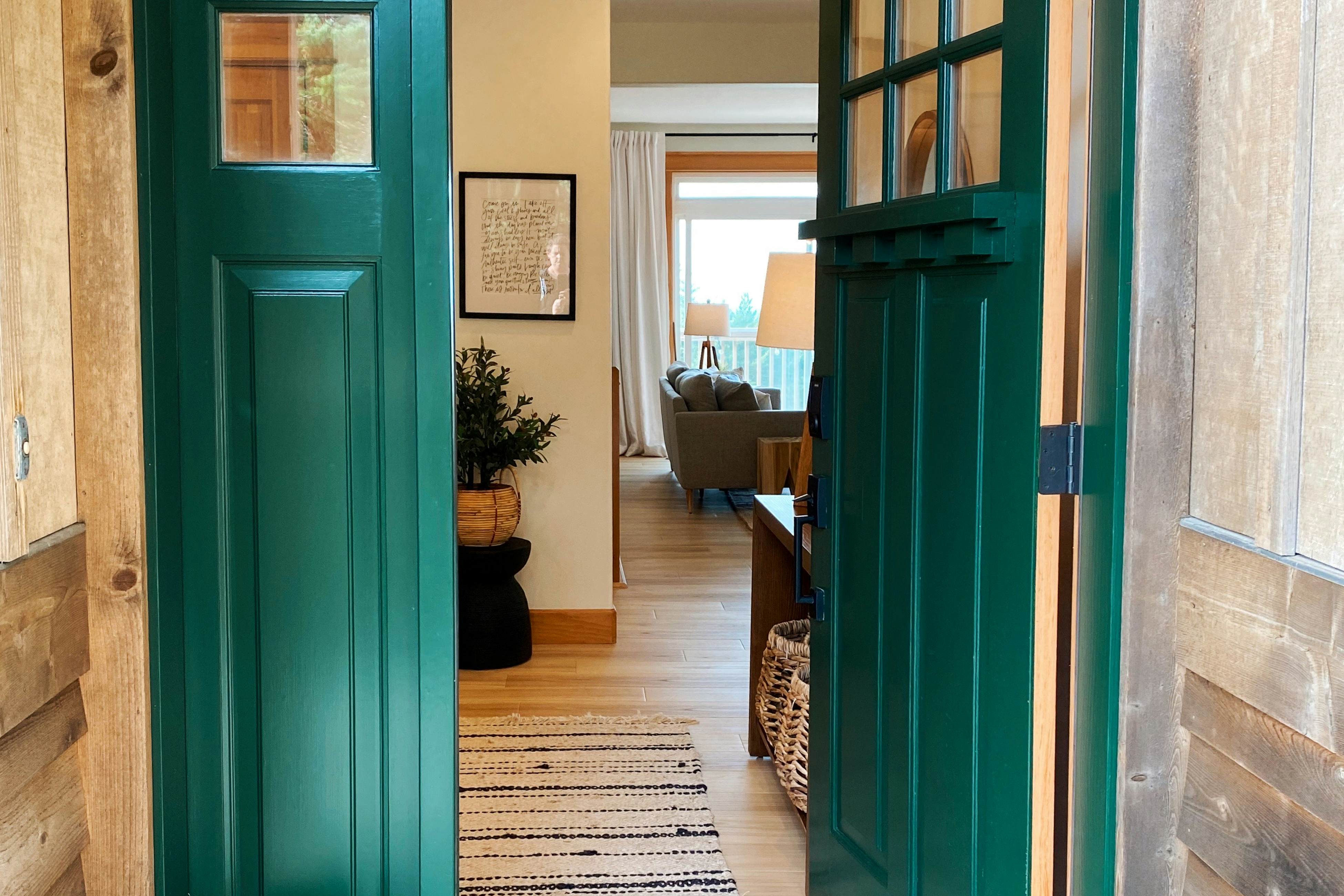 Dog-friendly home with ocean views, deck, washer/dryer, grill, & fireplace