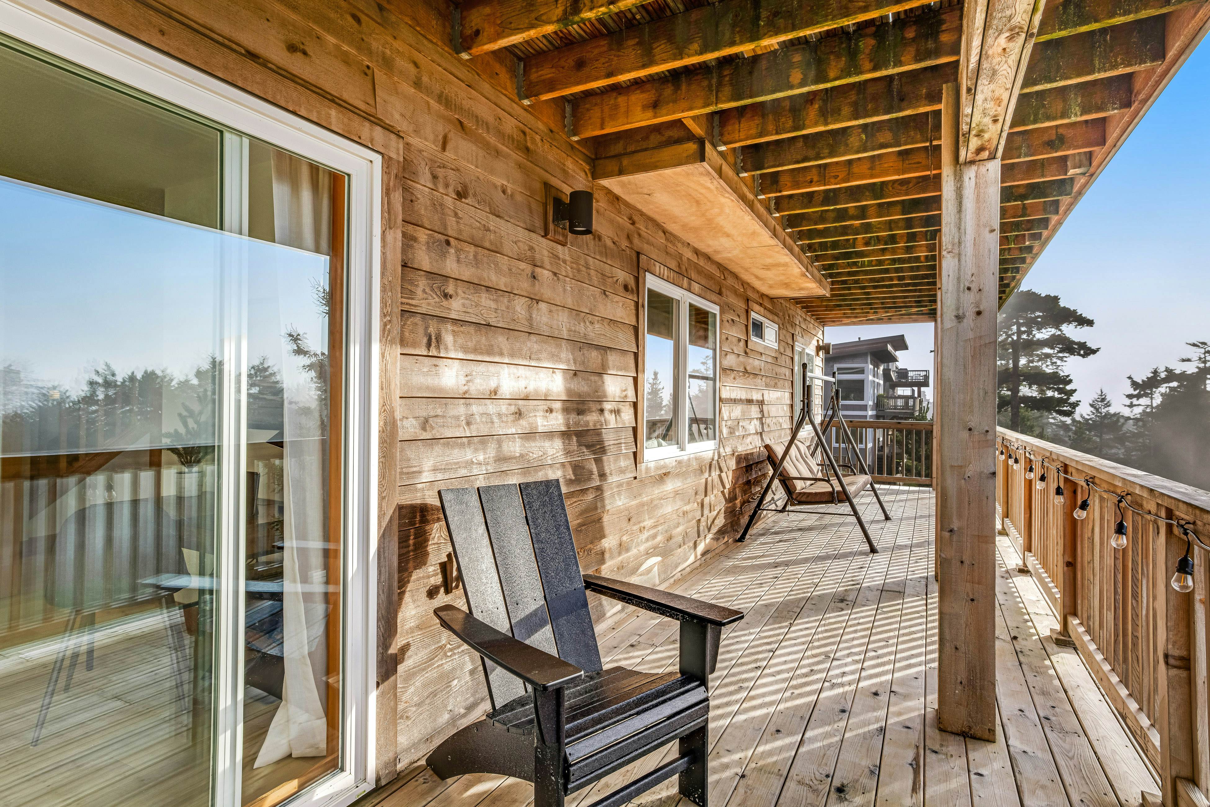 Dog-friendly home with ocean views, deck, washer/dryer, grill, & fireplace