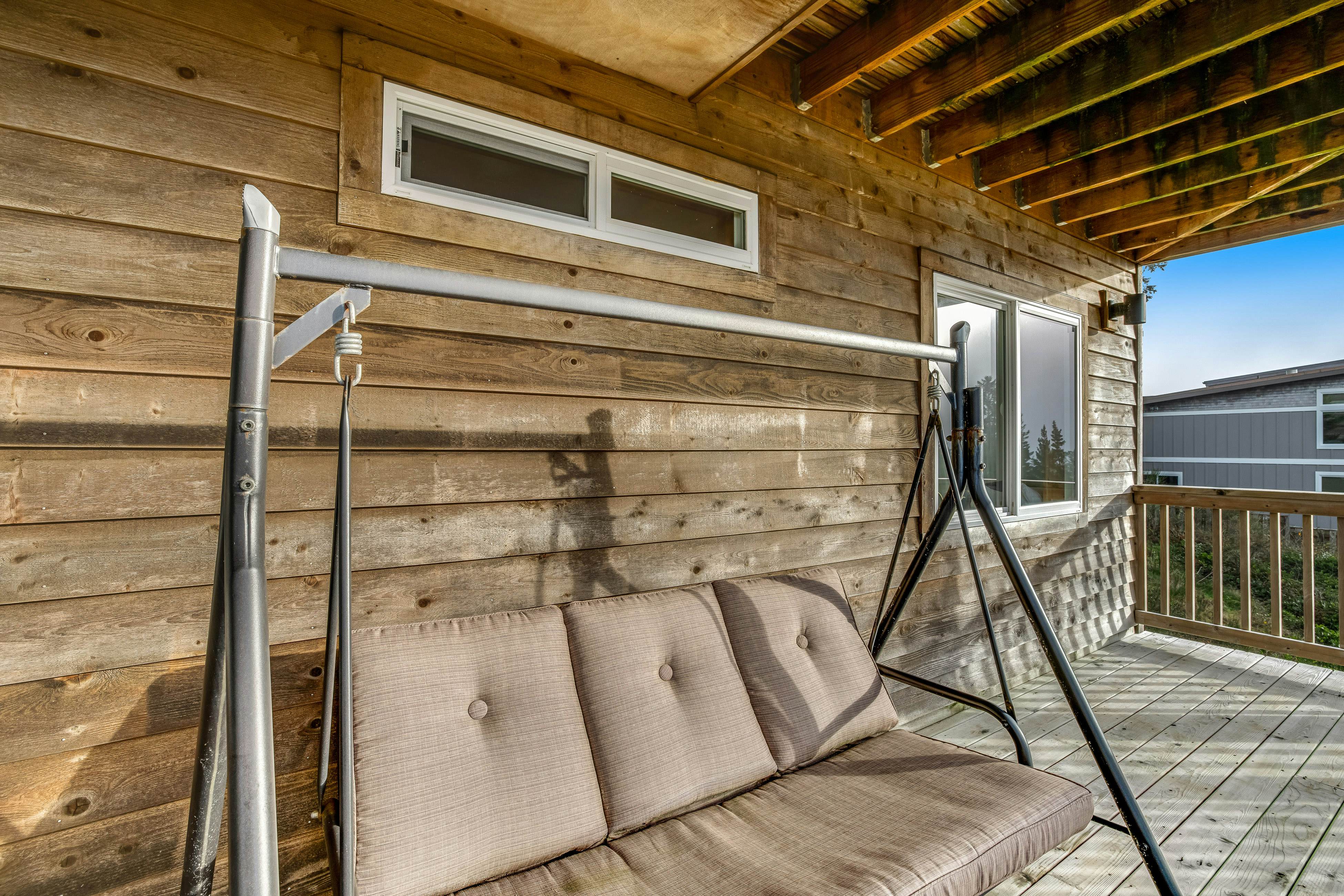 Dog-friendly home with ocean views, deck, washer/dryer, grill, & fireplace