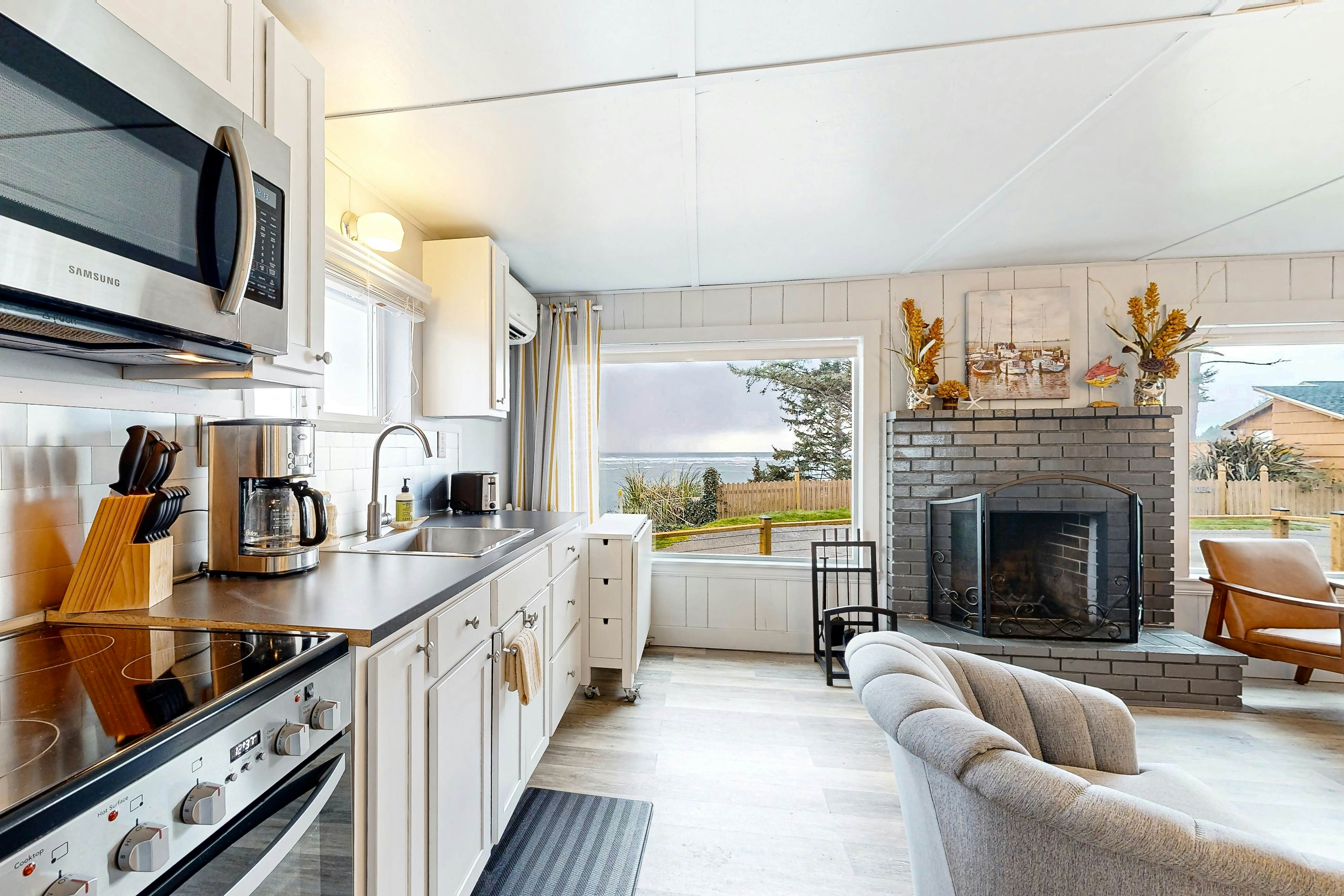 Quaint oceanfront hideaway with open layout fireplace central AC and gas grill