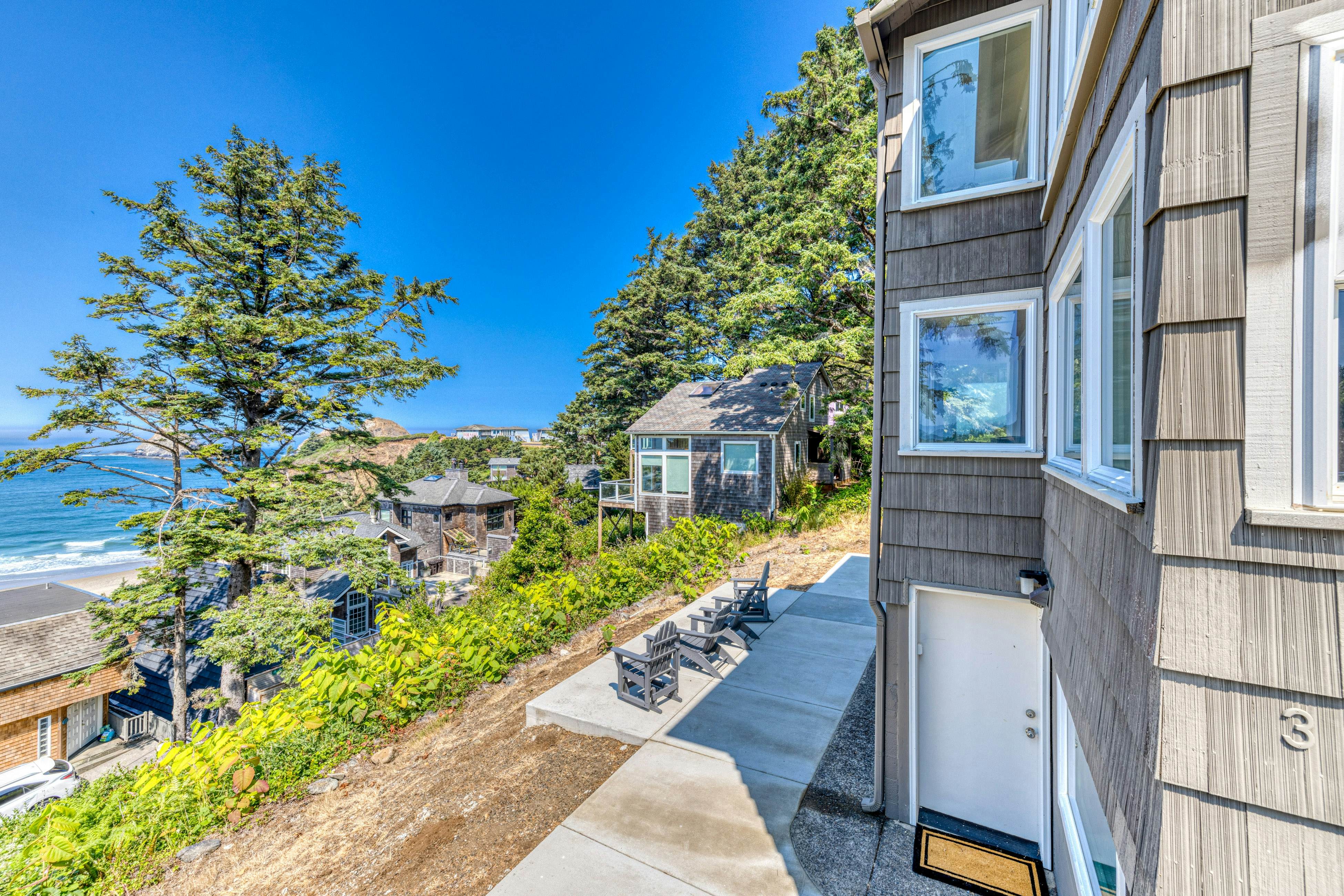 Amazing ocean-view escape with seven bedrooms, scenic patios, & modern interior