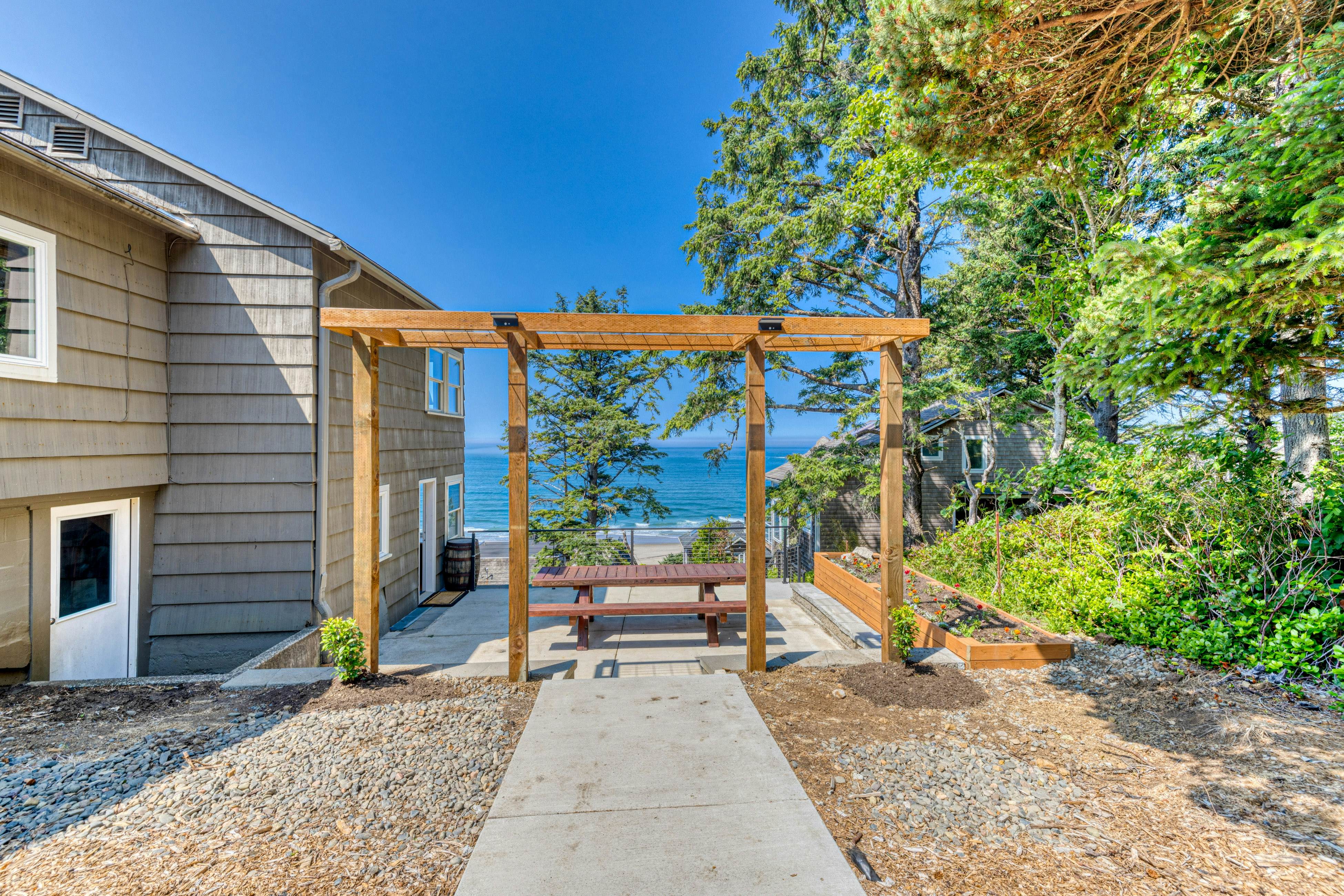 Amazing ocean-view escape with seven bedrooms, scenic patios, & modern interior