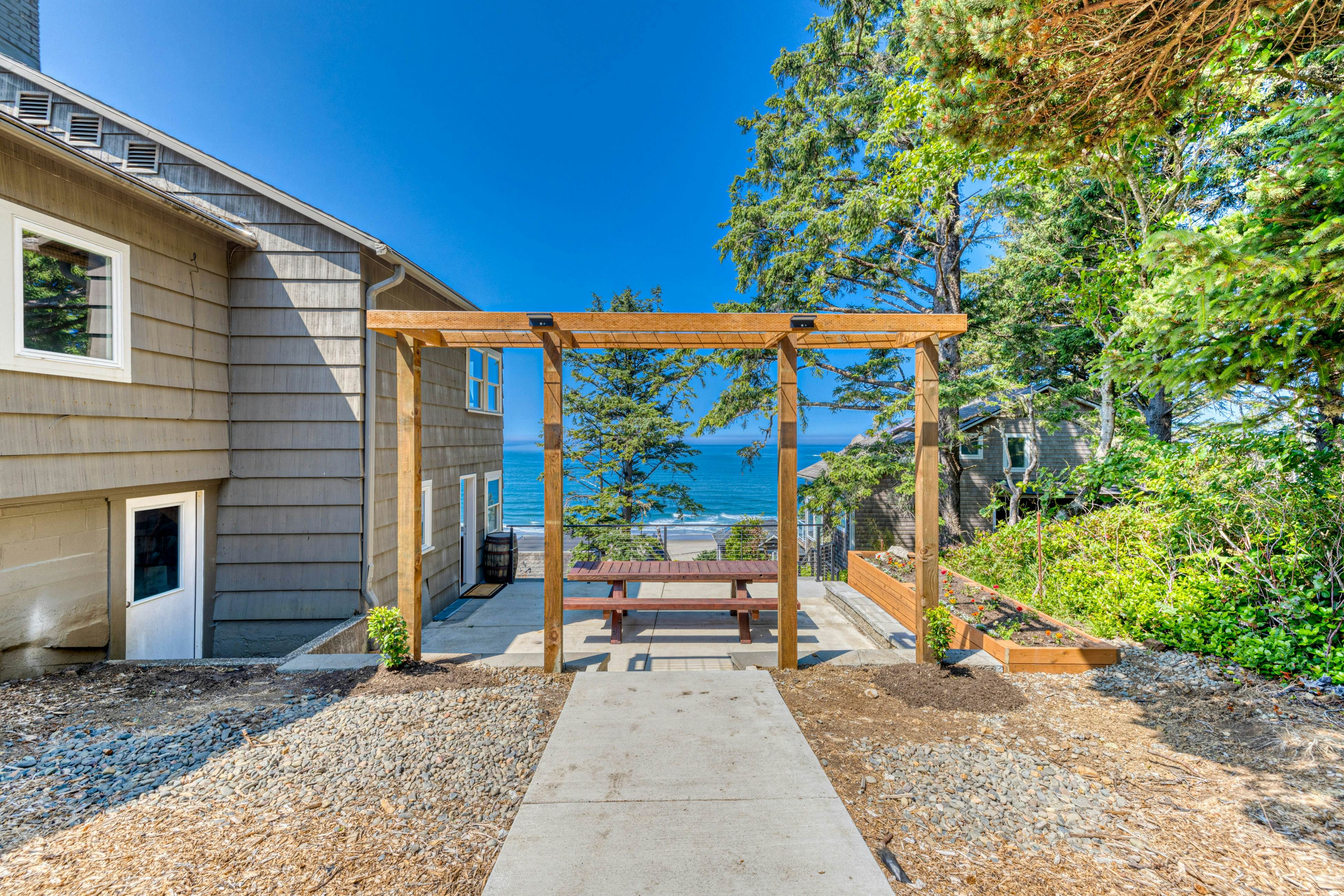 Amazing ocean-view escape with seven bedrooms, scenic patios, & modern interior