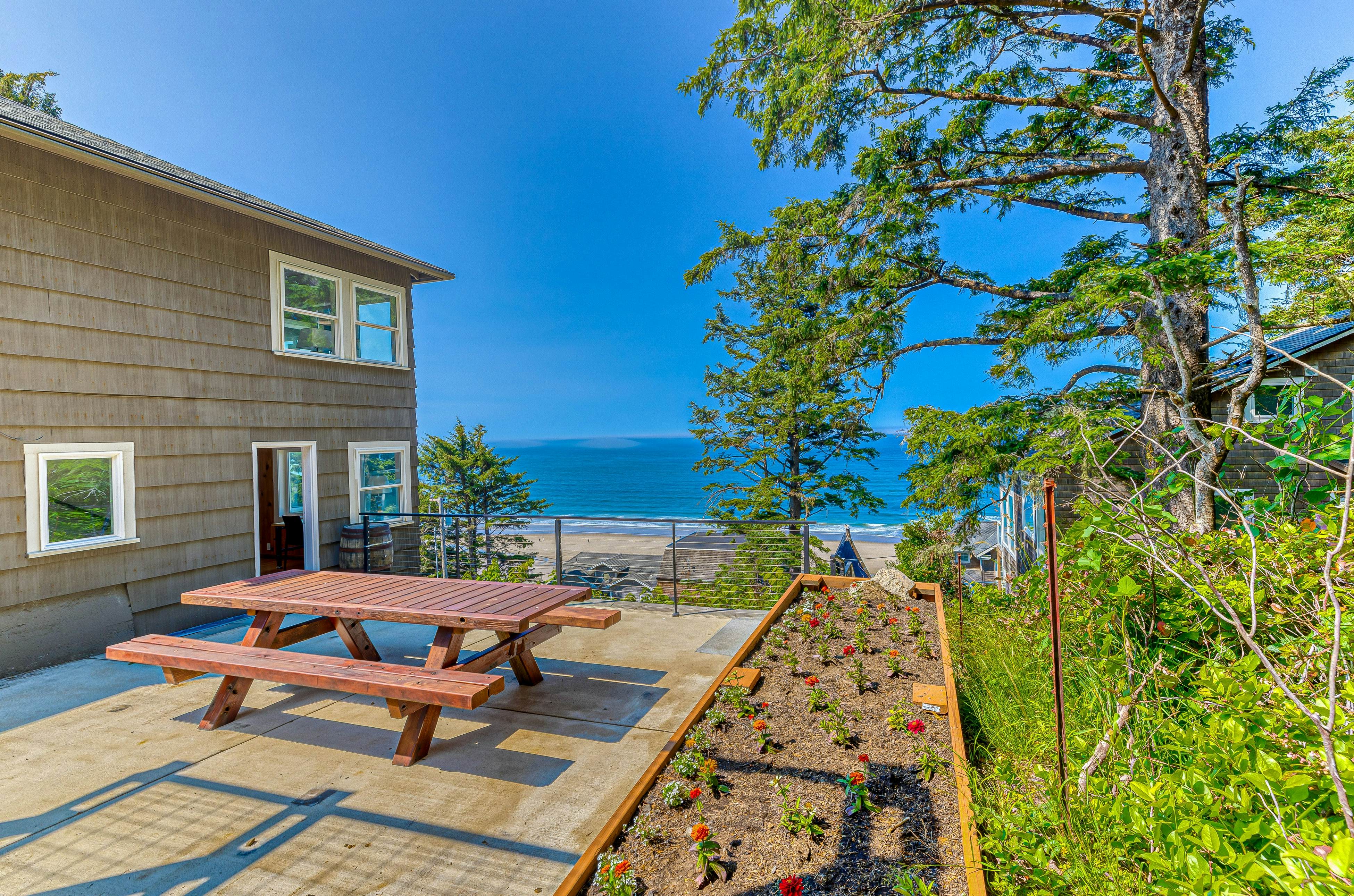 Spacious ocean view home with wood fireplace, grill, & deck - dog-friendly