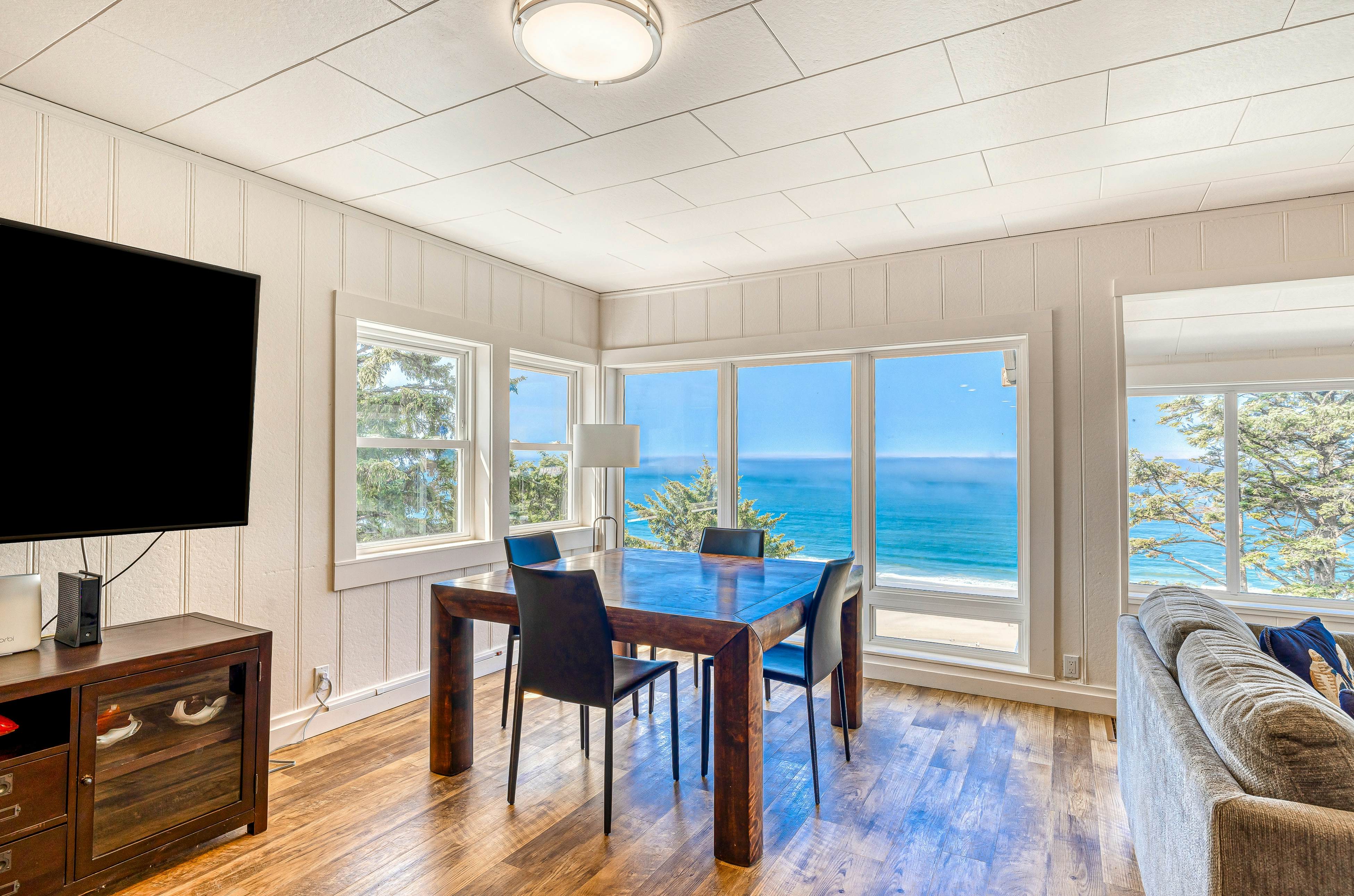 Spacious ocean view home with wood fireplace, grill, & deck - dog-friendly