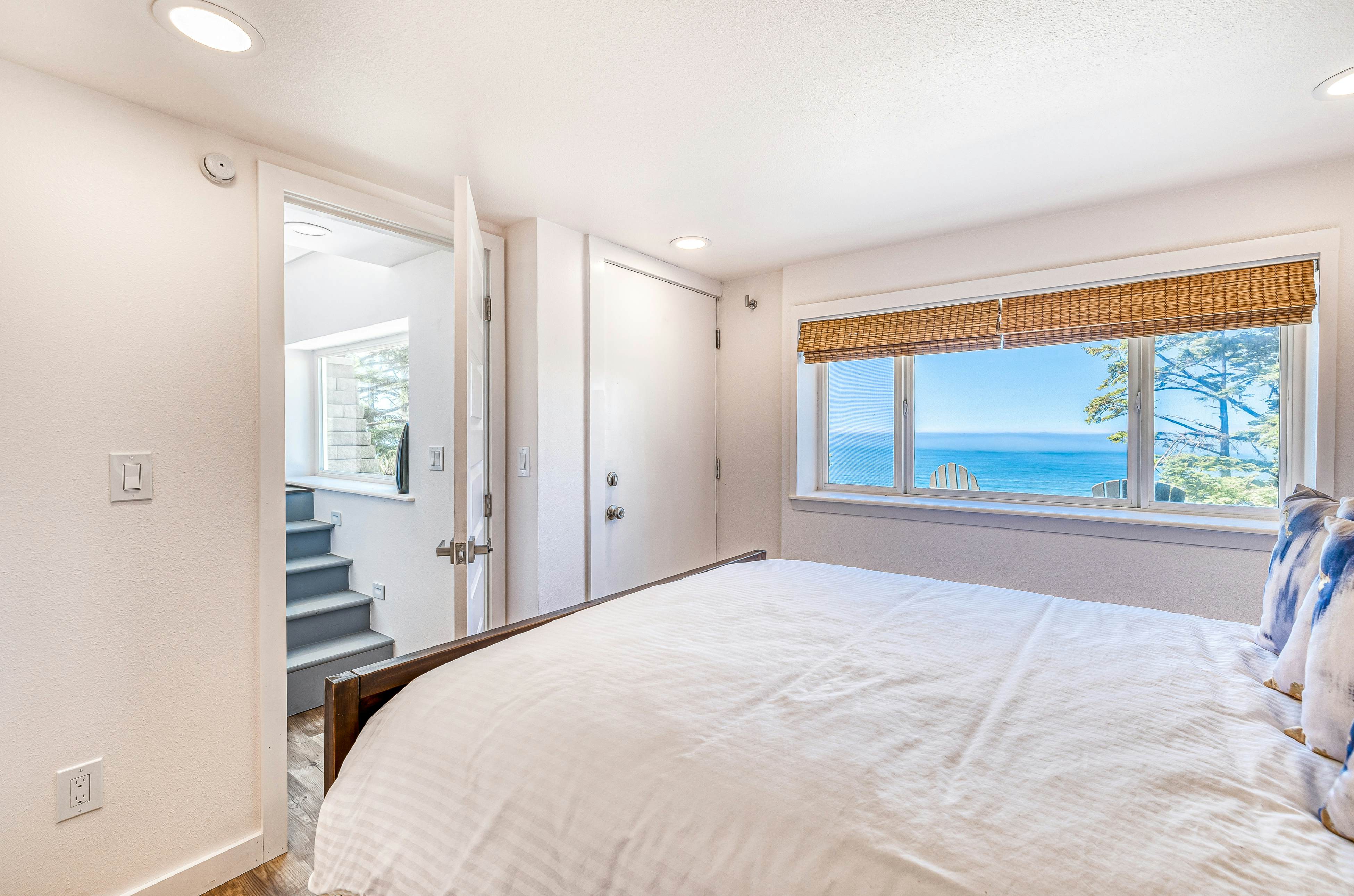 Spacious ocean view home with wood fireplace, grill, & deck - dog-friendly