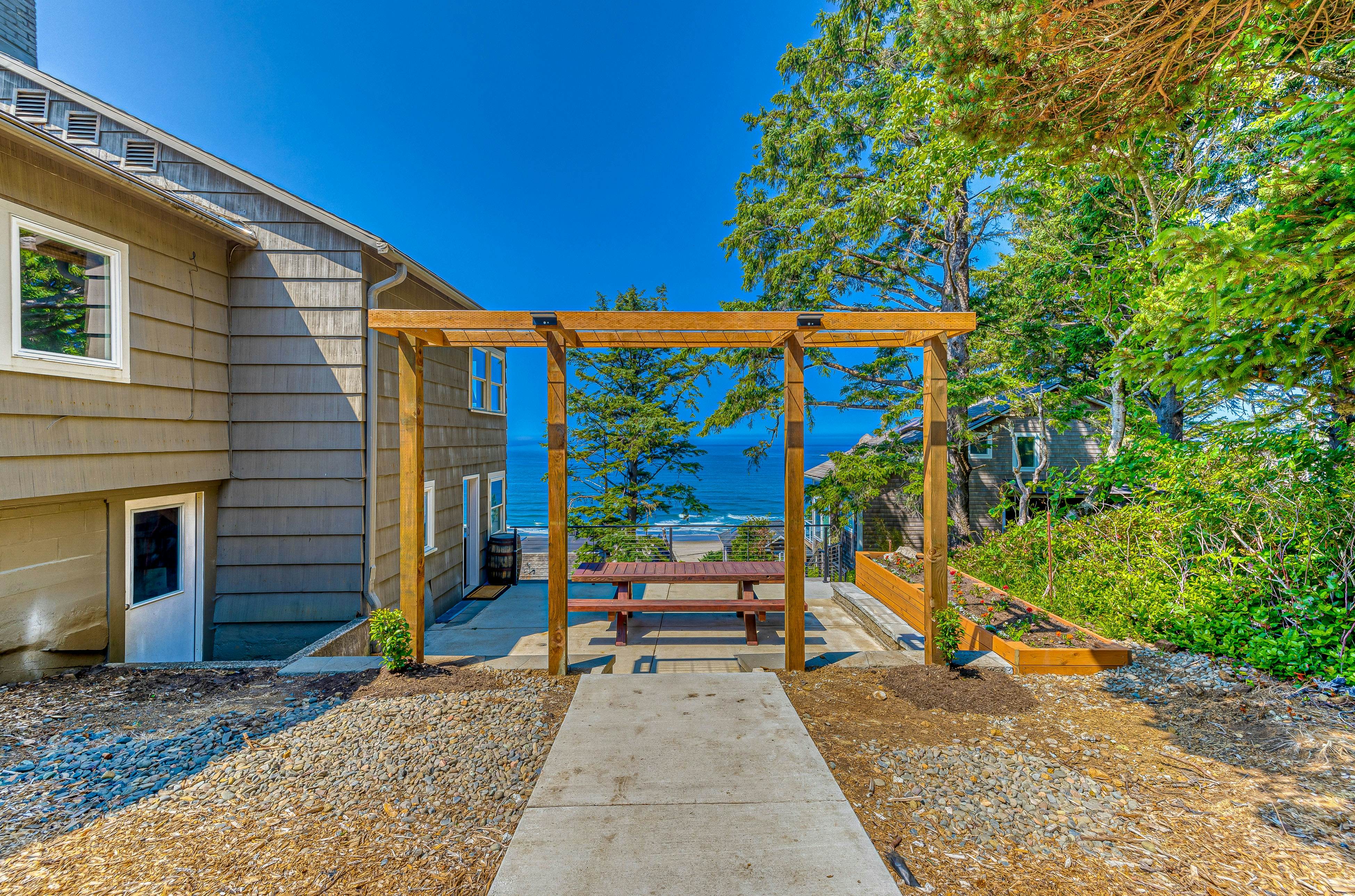 Spacious ocean view home with wood fireplace, grill, & deck - dog-friendly