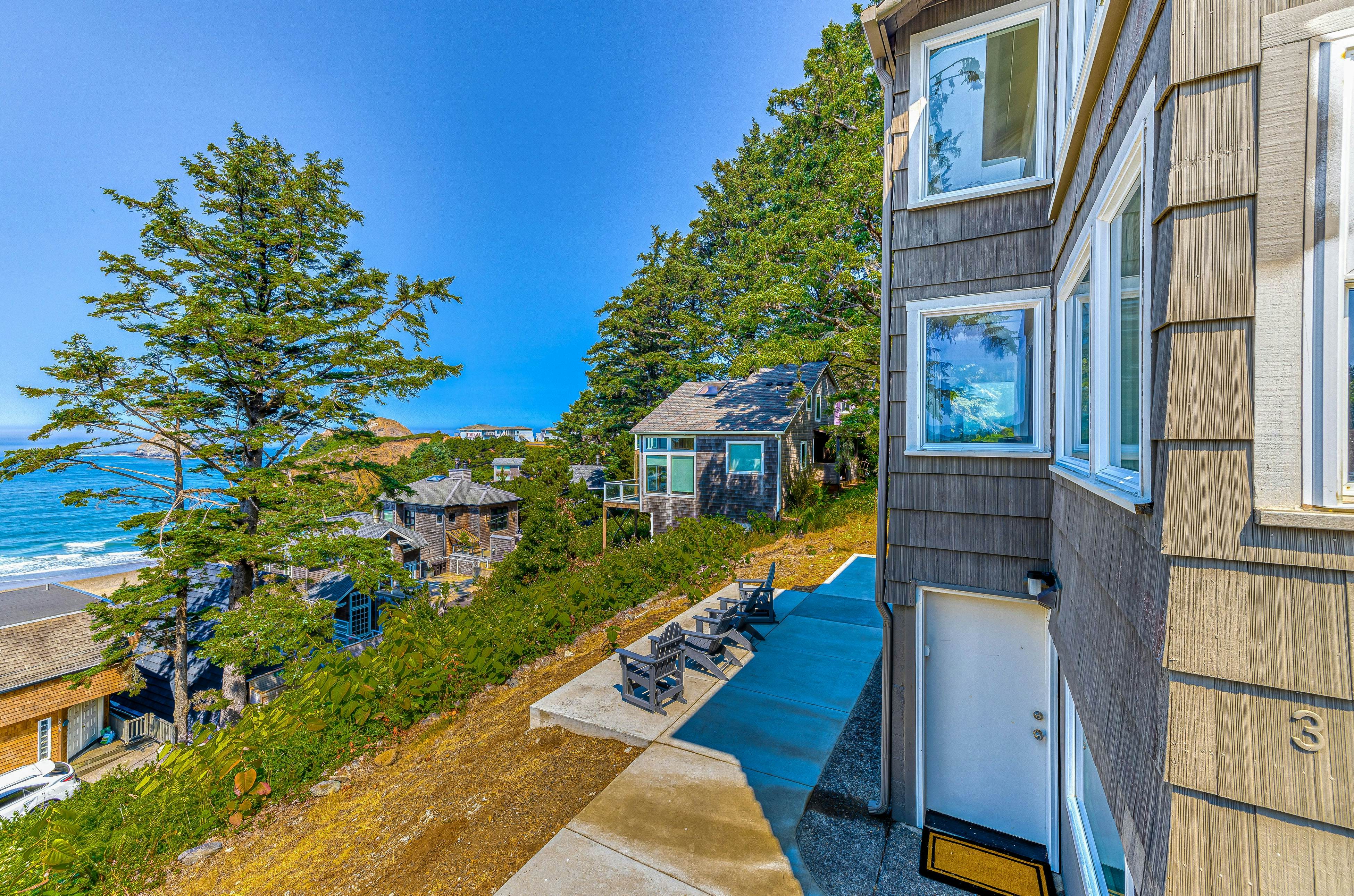 Spacious ocean view home with wood fireplace, grill, & deck - dog-friendly