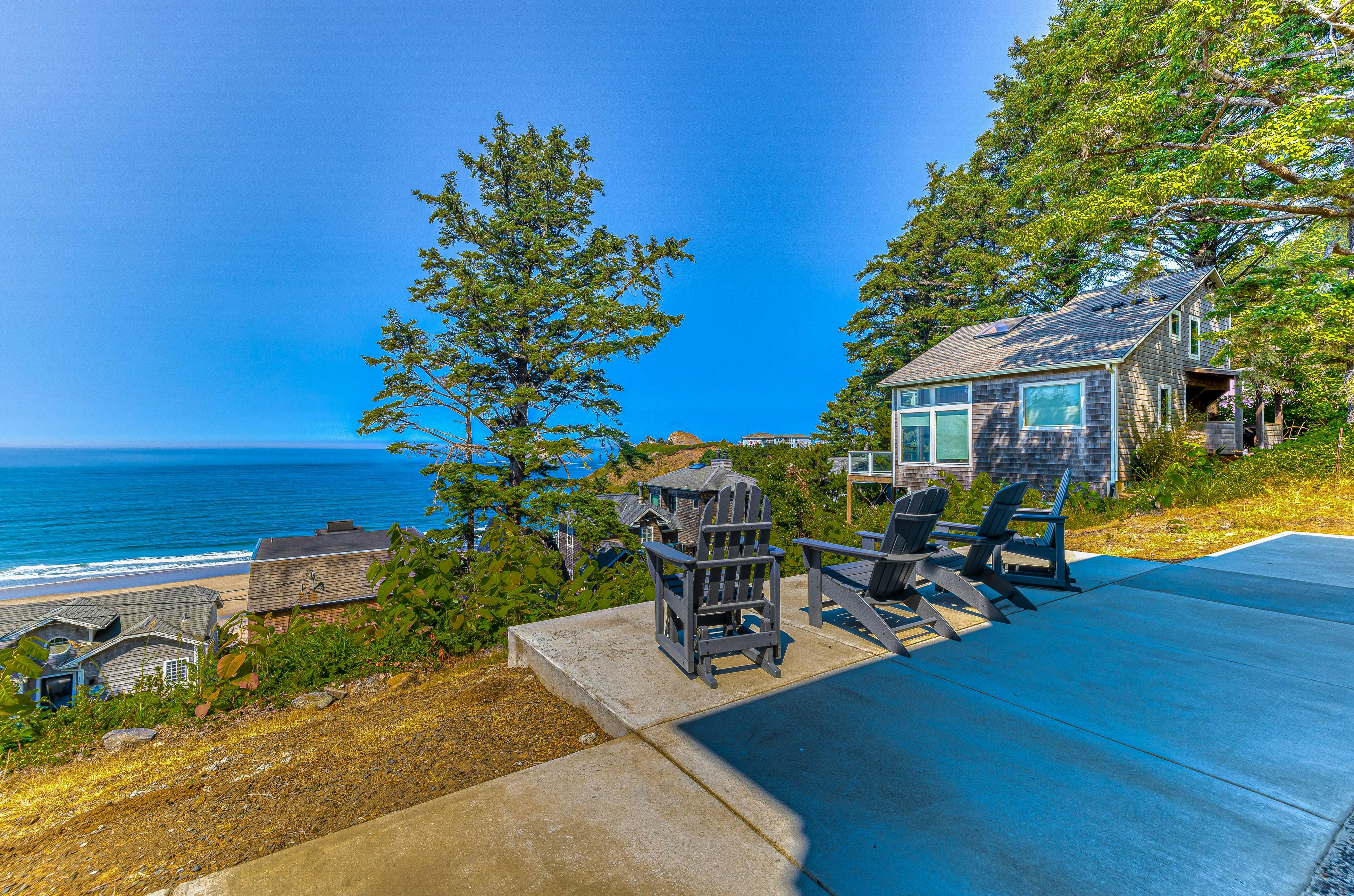 Spacious ocean view home with wood fireplace, grill, & deck - dog-friendly