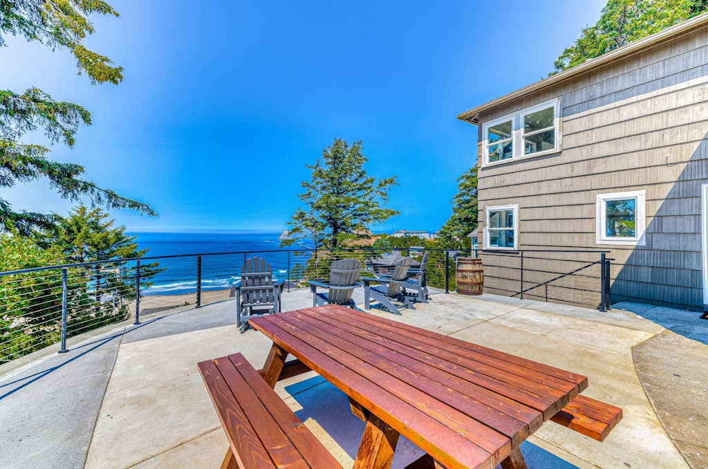 Quaint ocean view escape with modern interior smart TV and gorgeous deck