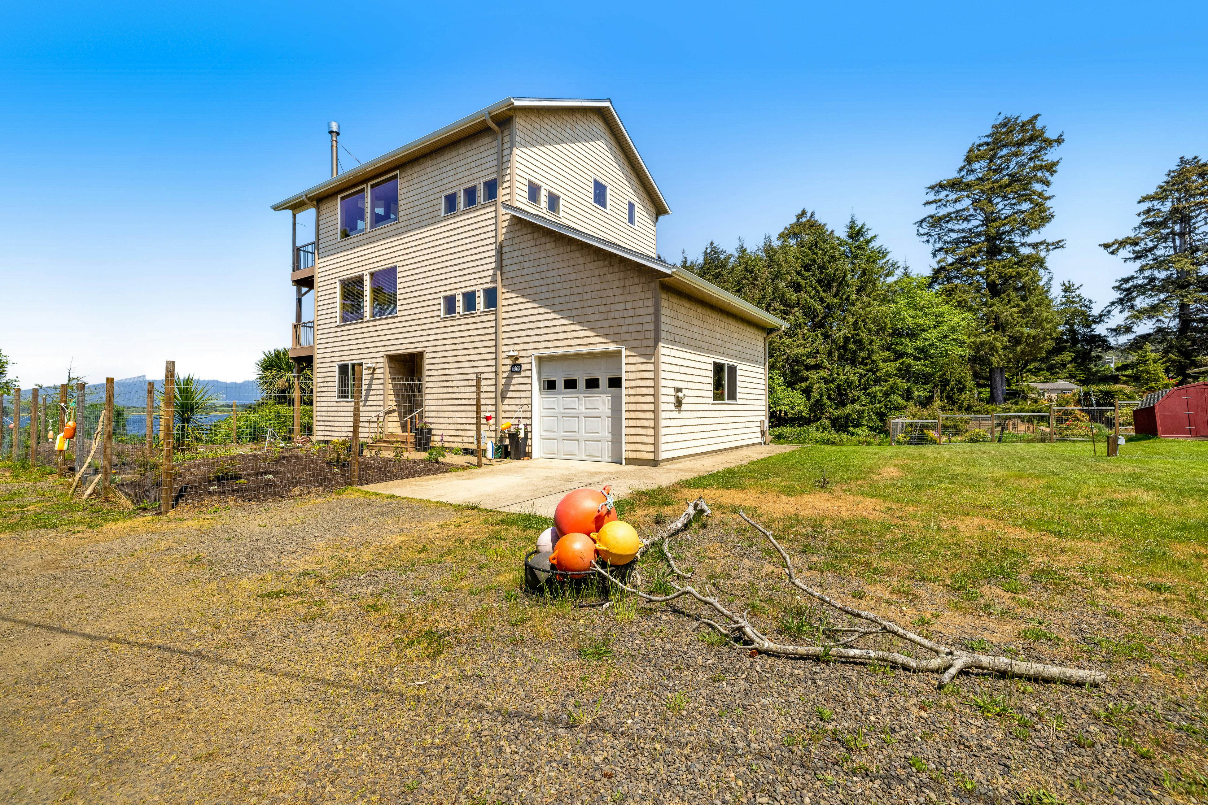 Lakefront escape with water views, grill, wrap-around deck - walk to beach