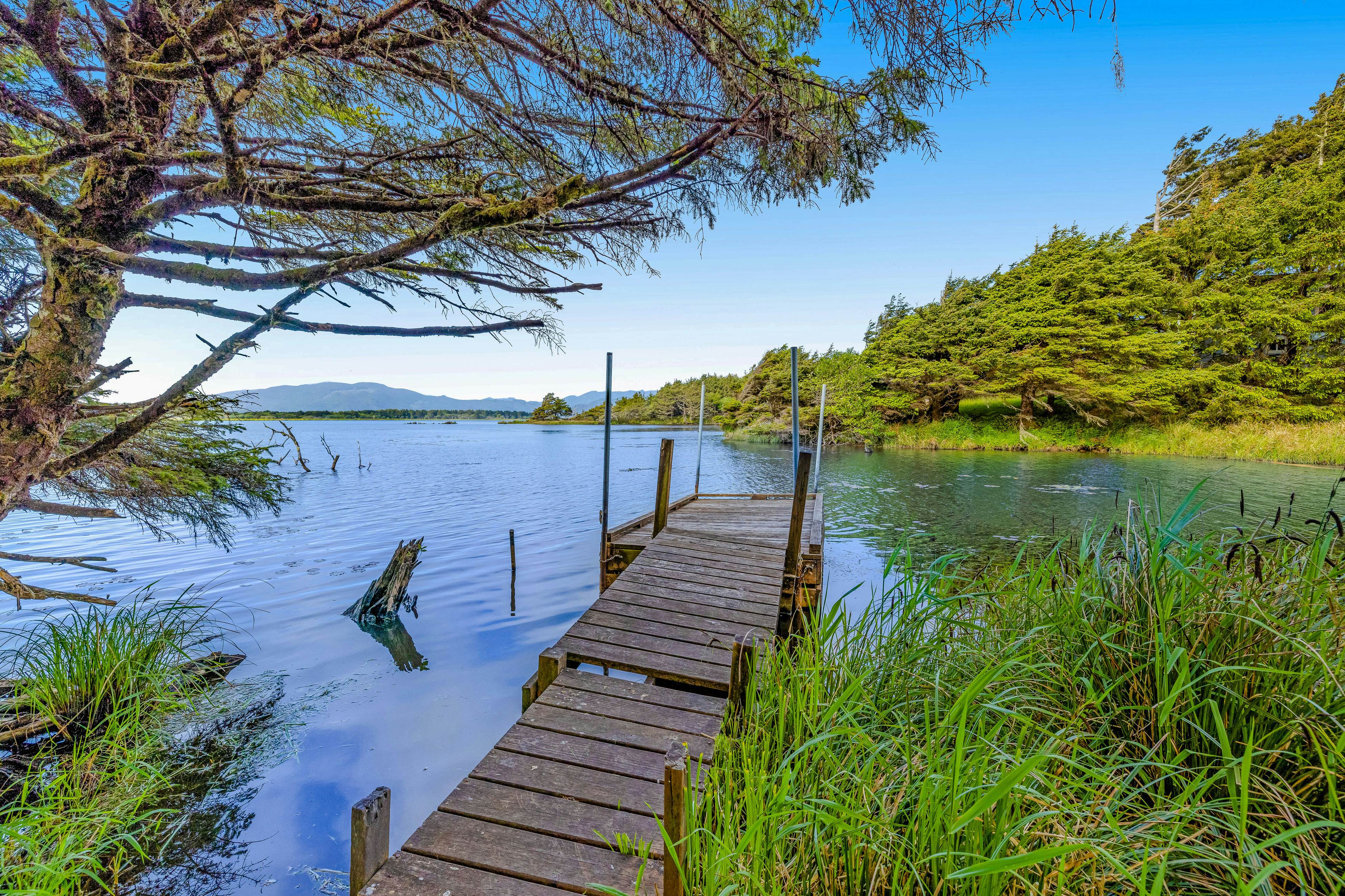 Lakefront escape with water views, grill, wrap-around deck - walk to beach