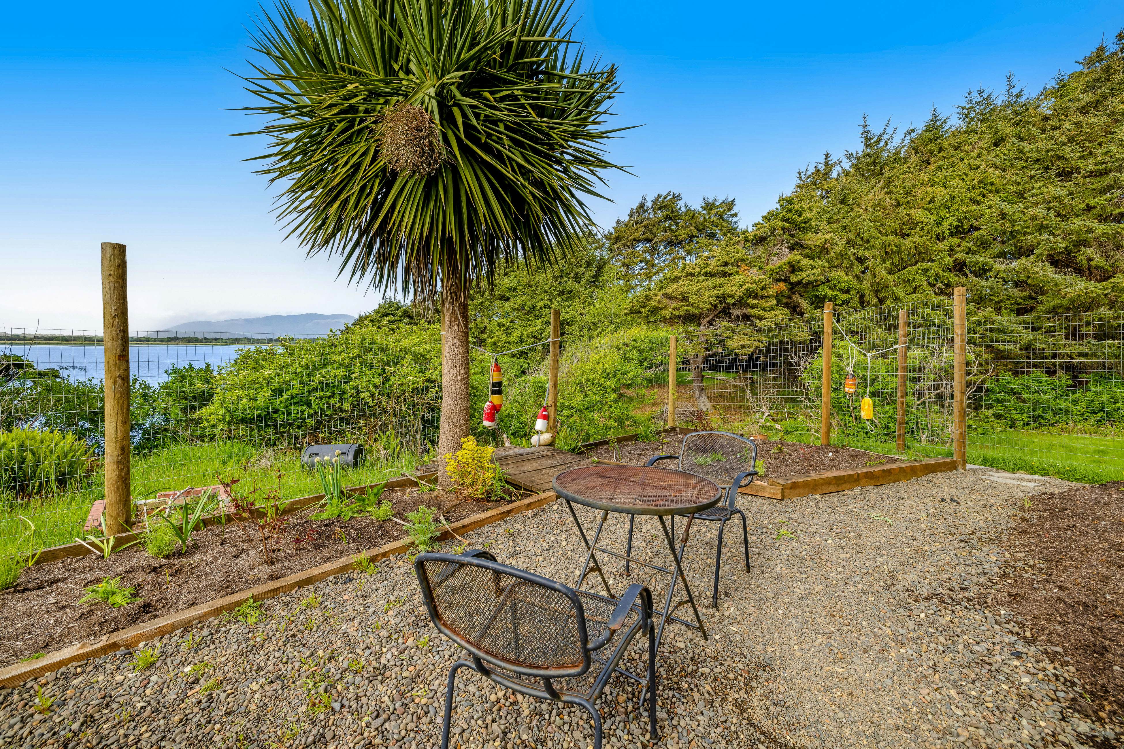 Lakefront escape with water views, grill, wrap-around deck - walk to beach