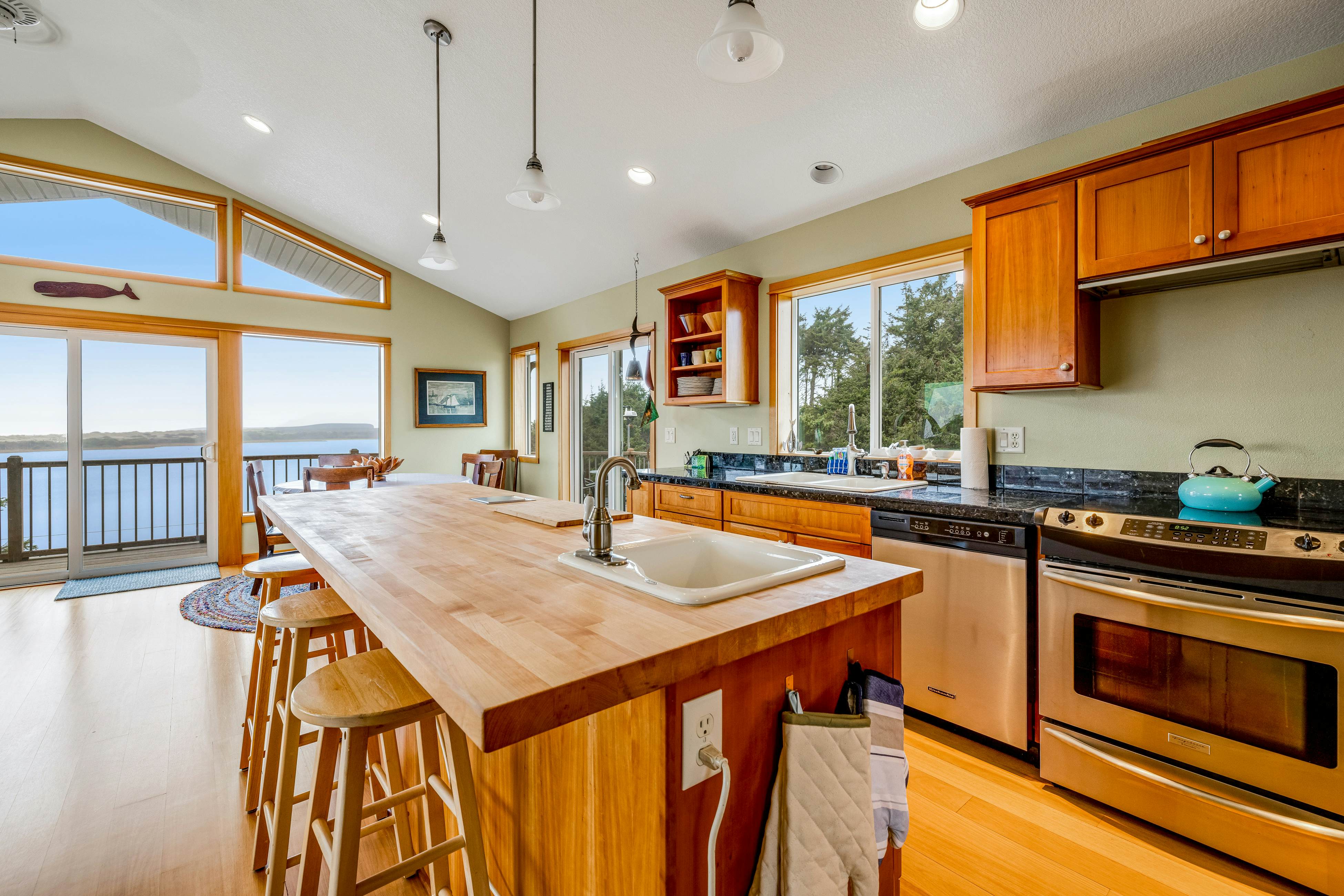 Lakefront escape with water views, grill, wrap-around deck - walk to beach