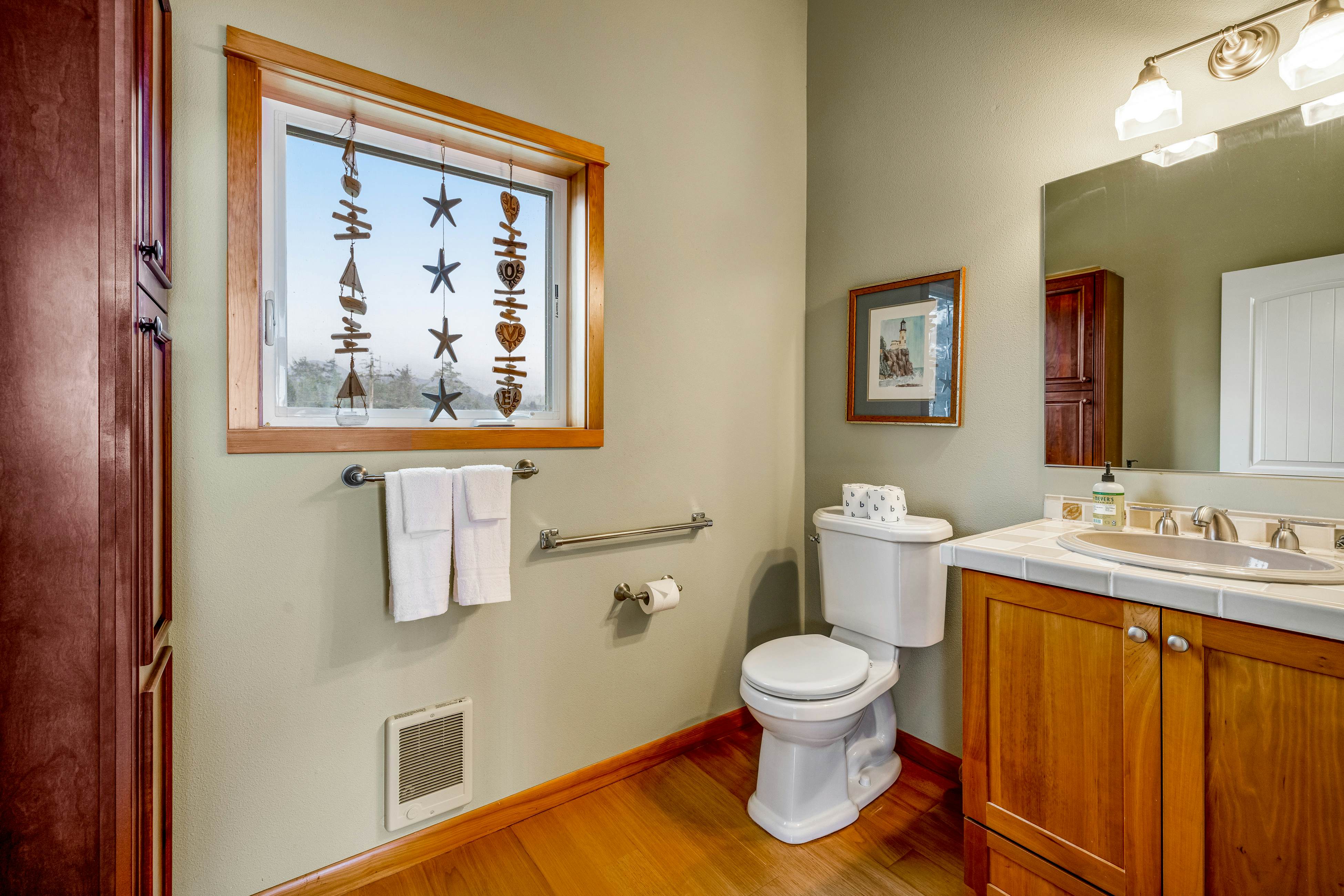 Lakefront escape with water views, grill, wrap-around deck - walk to beach