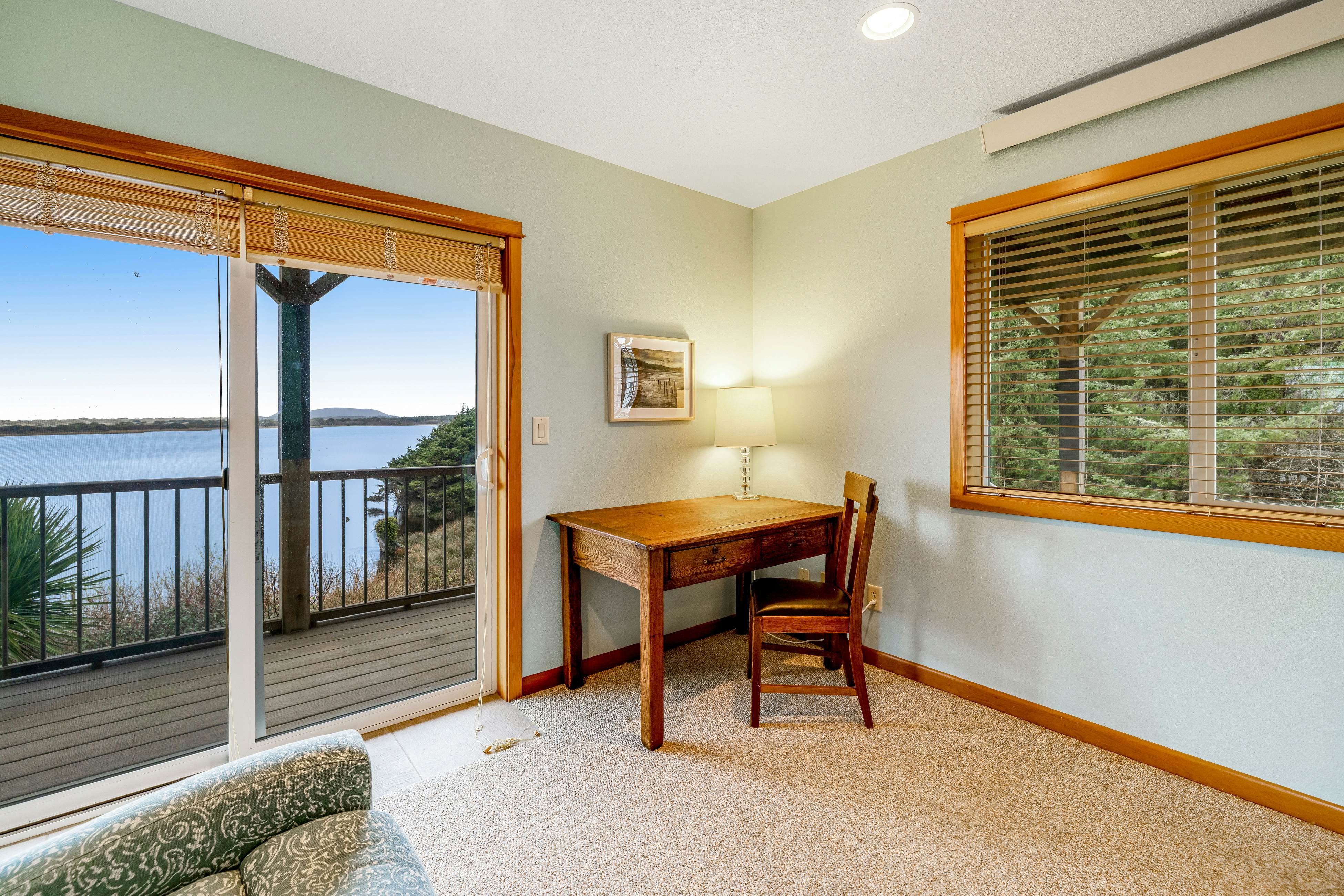 Lakefront escape with water views, grill, wrap-around deck - walk to beach