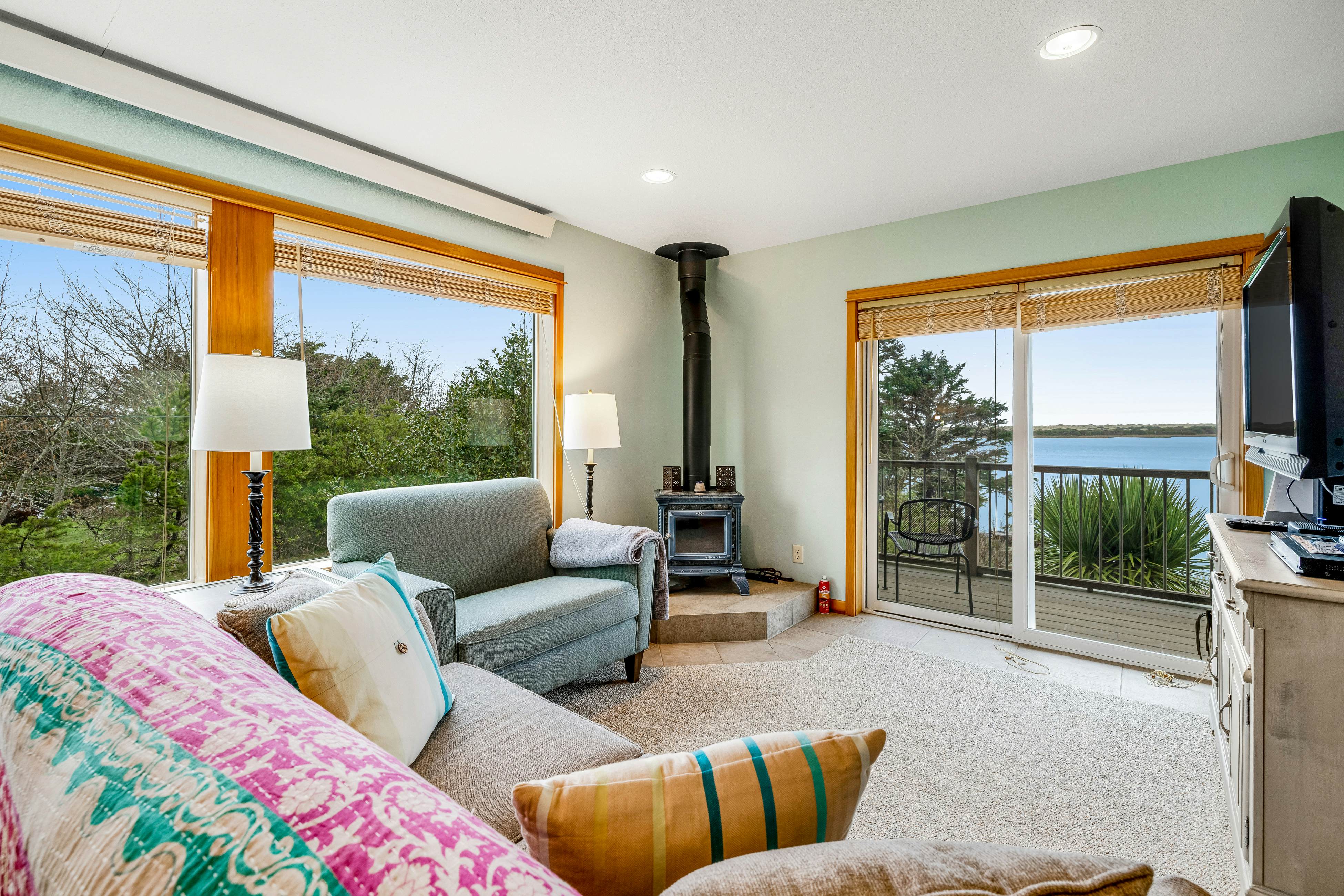 Lakefront escape with water views, grill, wrap-around deck - walk to beach