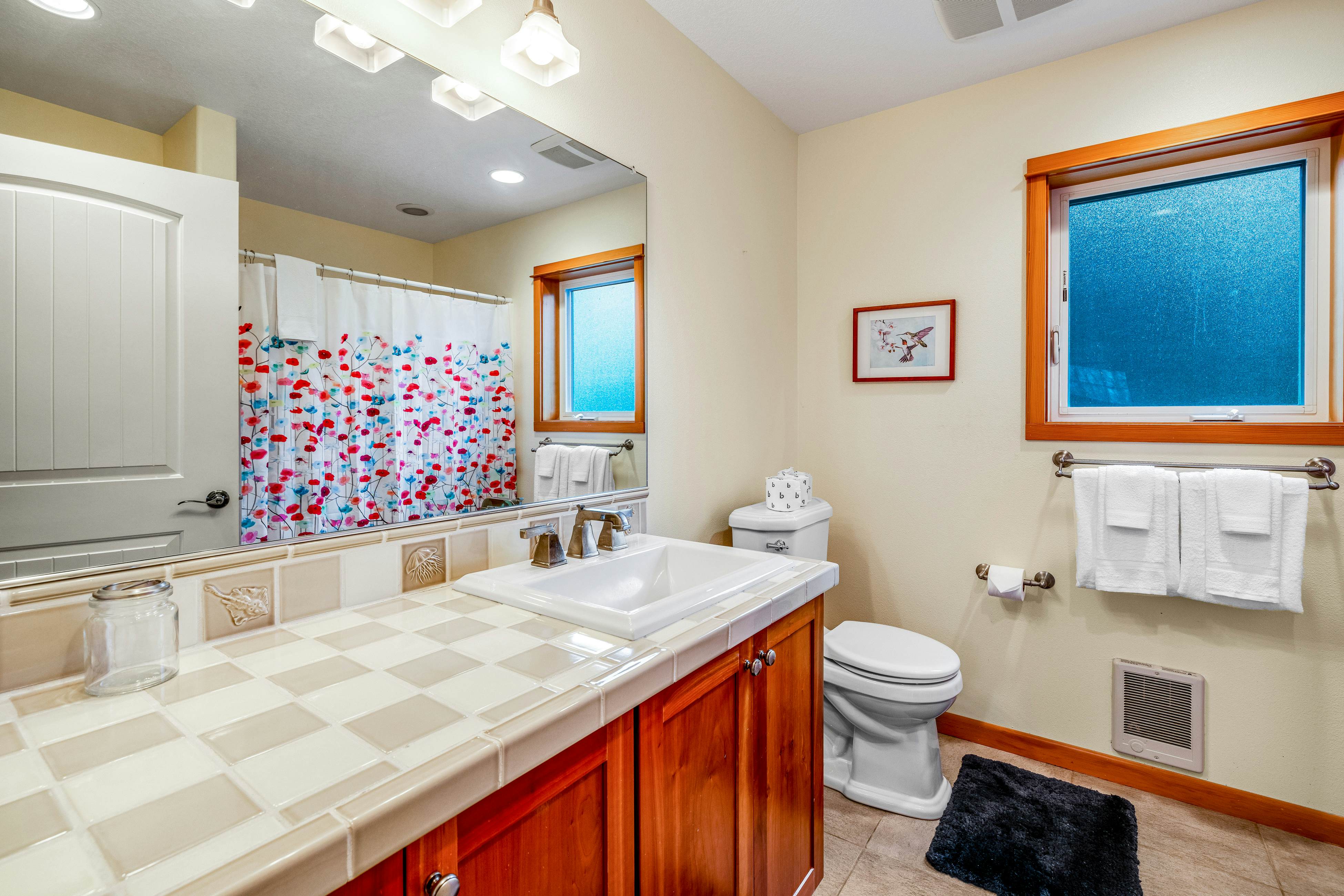 Lakefront escape with water views, grill, wrap-around deck - walk to beach