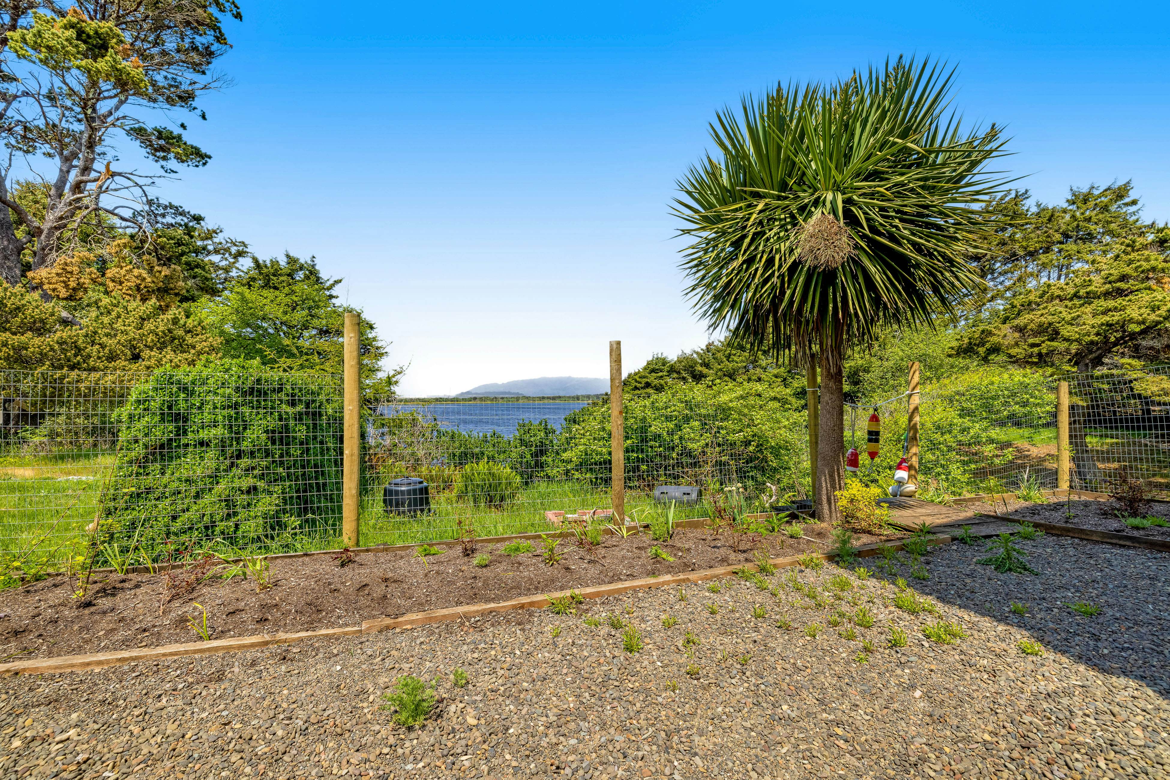 Lakefront escape with water views, grill, wrap-around deck - walk to beach