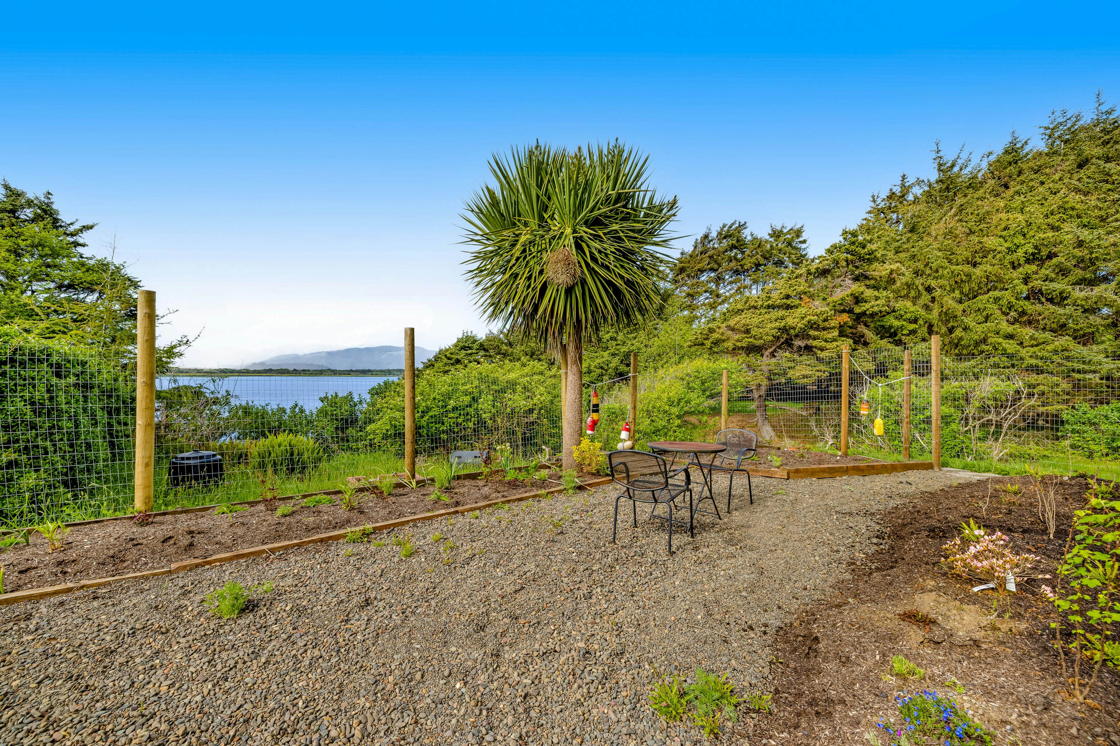 Lakefront escape with water views, grill, wrap-around deck - walk to beach