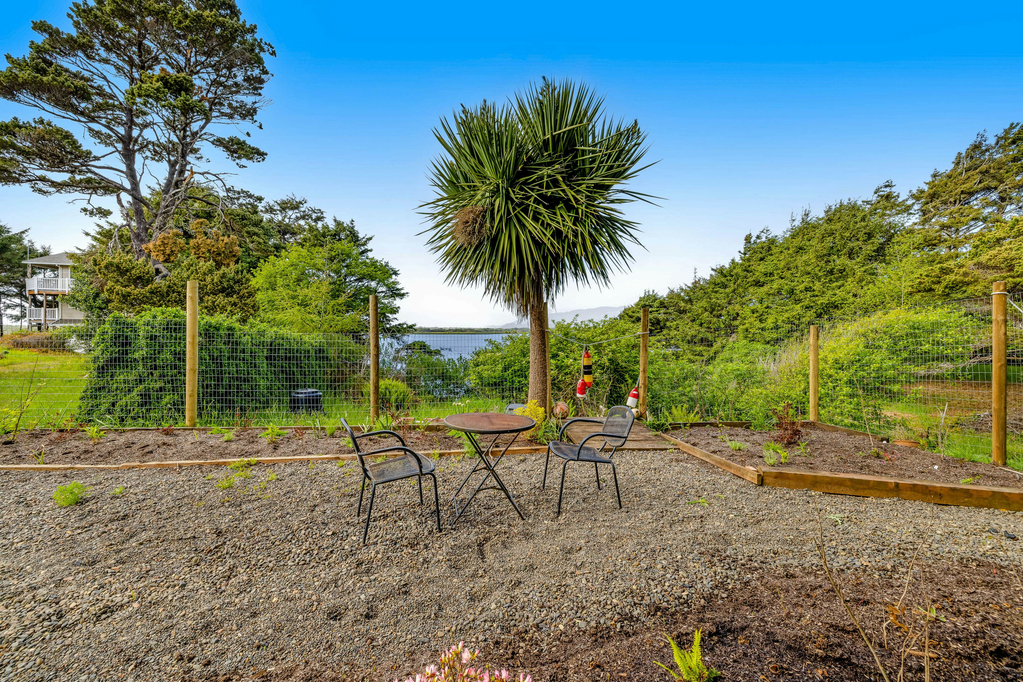 Lakefront escape with water views, grill, wrap-around deck - walk to beach