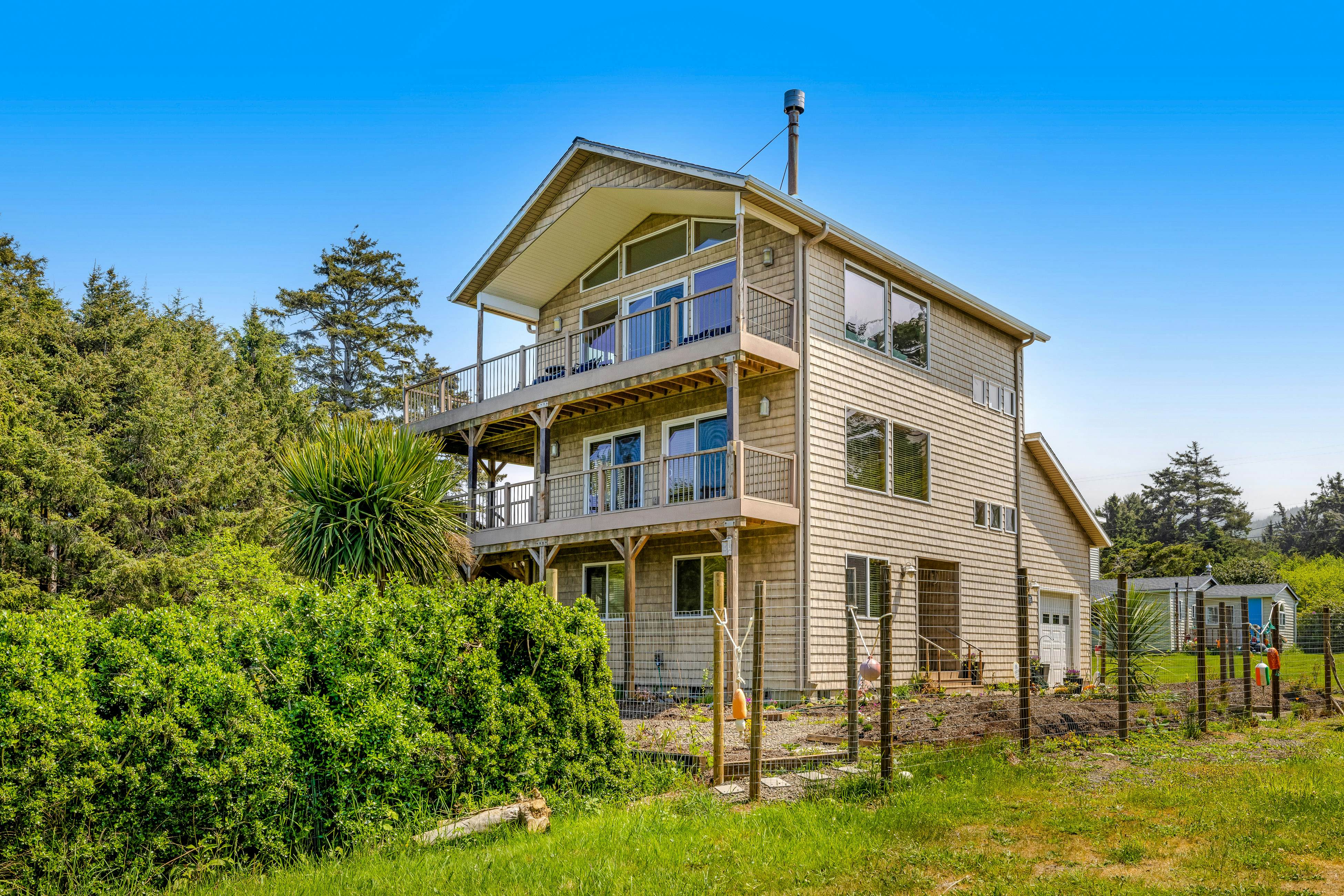 Lakefront escape with water views, grill, wrap-around deck - walk to beach