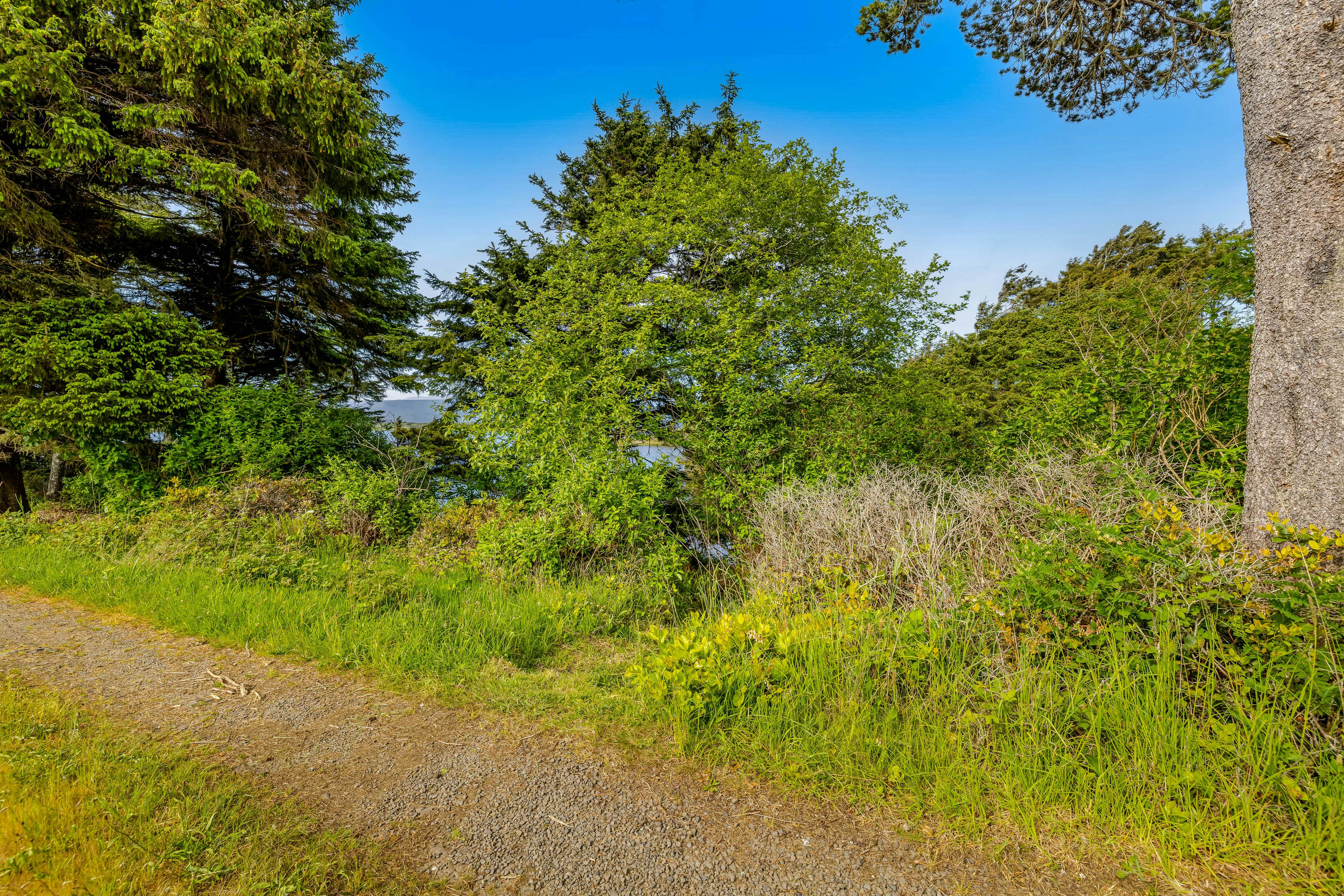 Lakefront escape with water views, grill, wrap-around deck - walk to beach