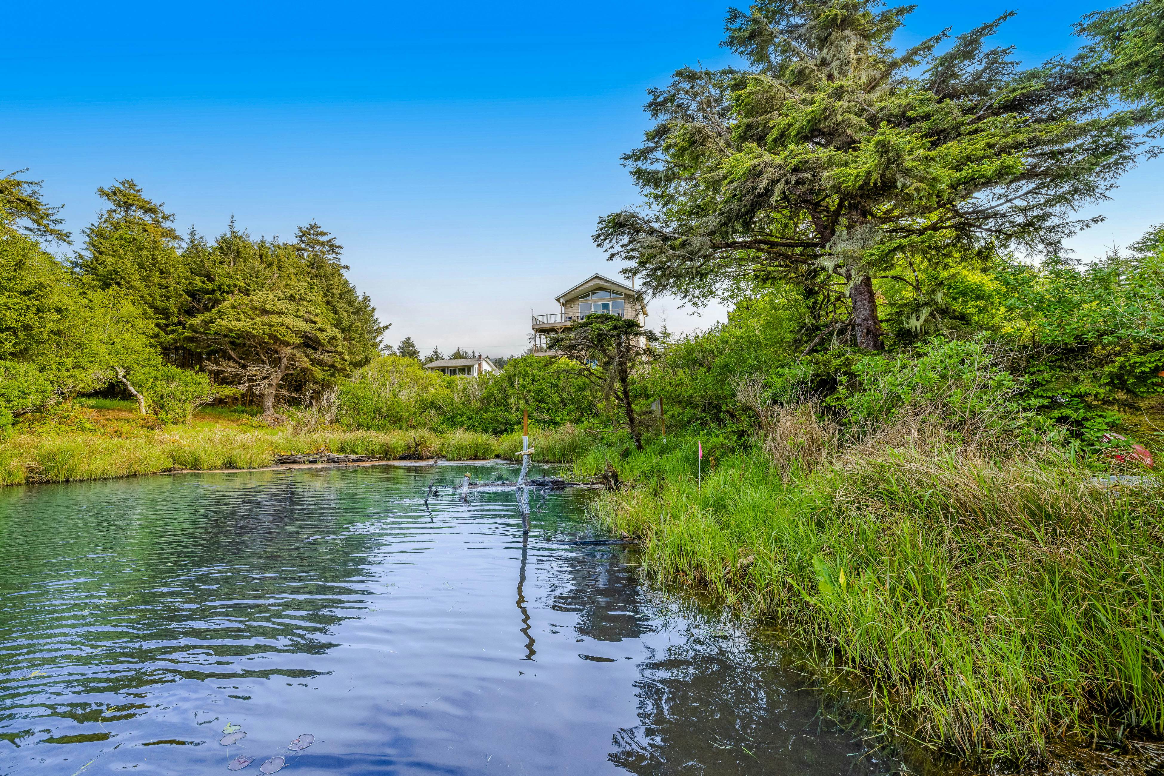 Lakefront escape with water views, grill, wrap-around deck - walk to beach