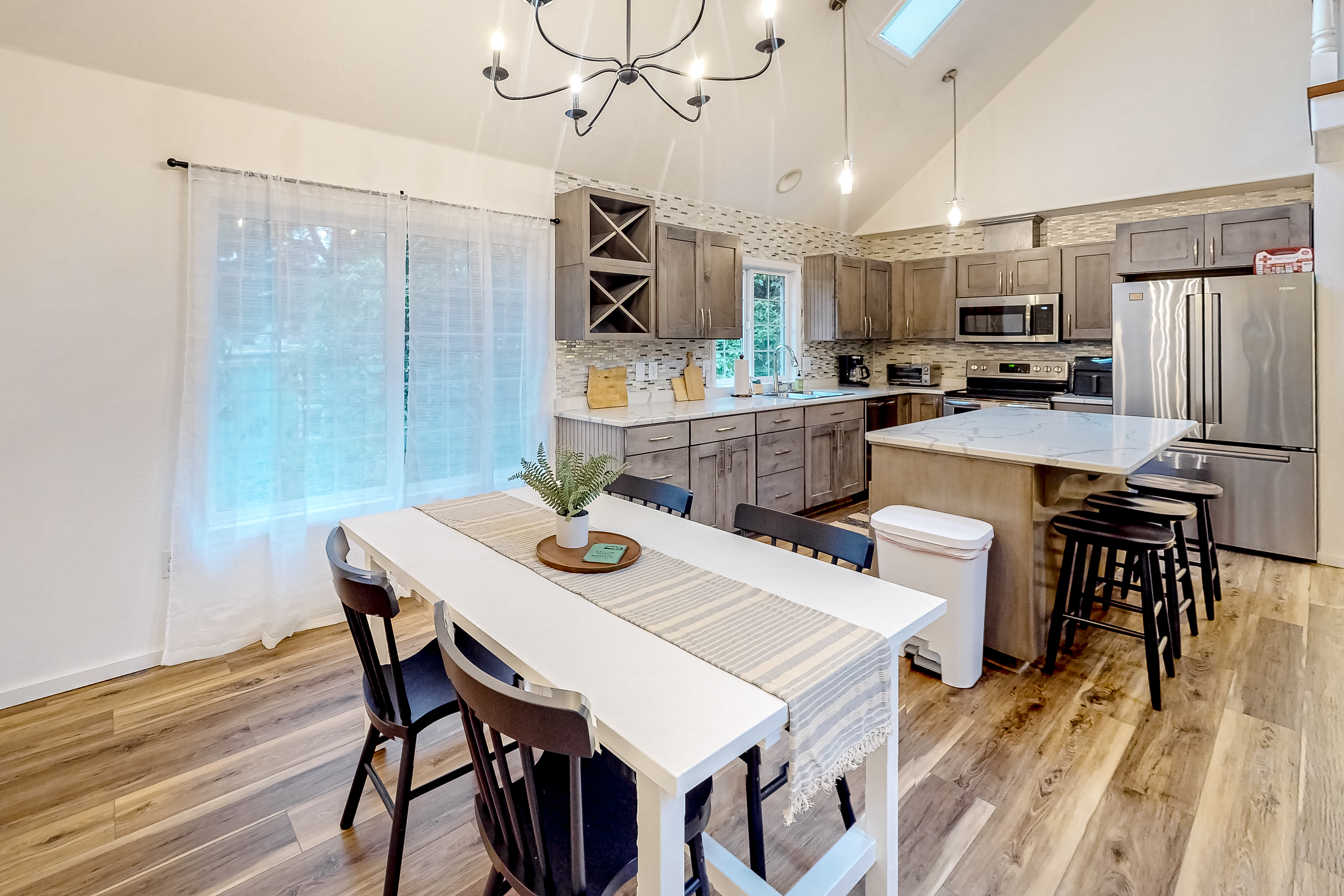 Renovated three story home by the beach with a furnished deck and washer dryer